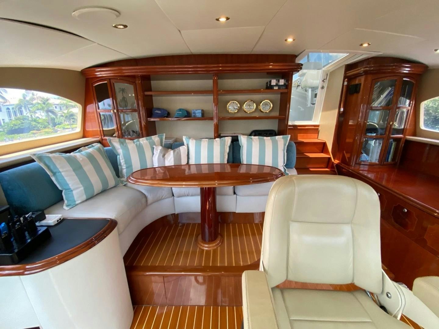a living room with a couch and a table aboard PASSION Yacht for Sale