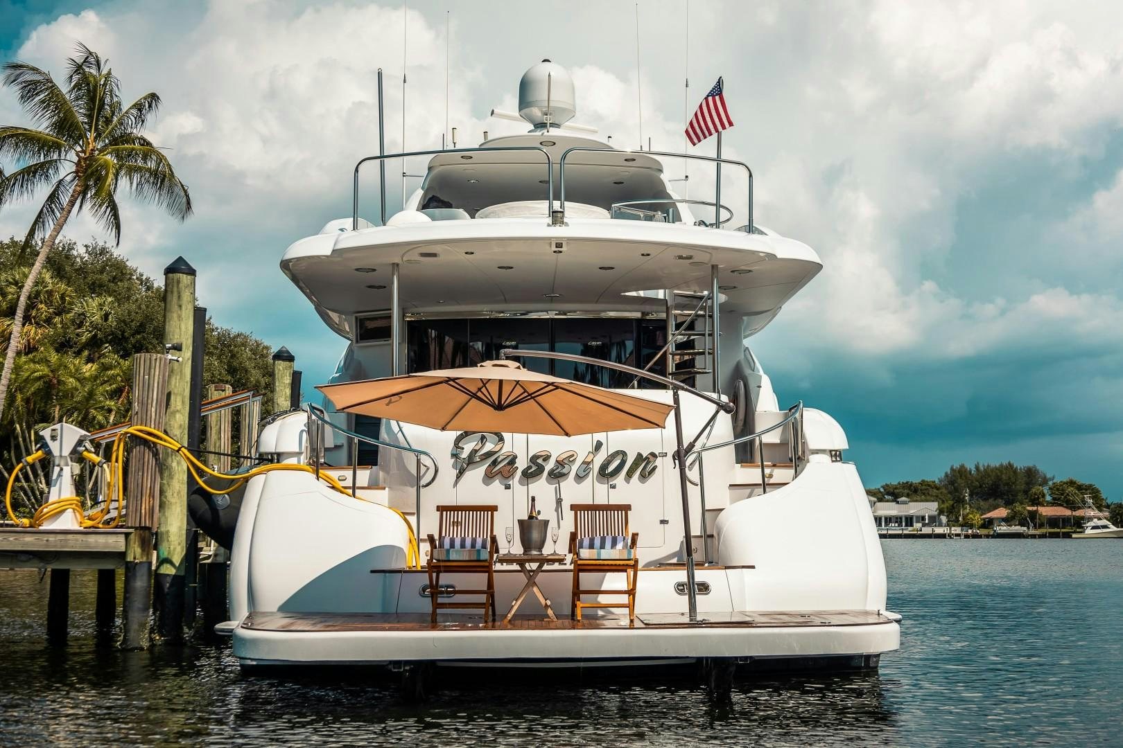 a large white boat docked aboard PASSION Yacht for Sale