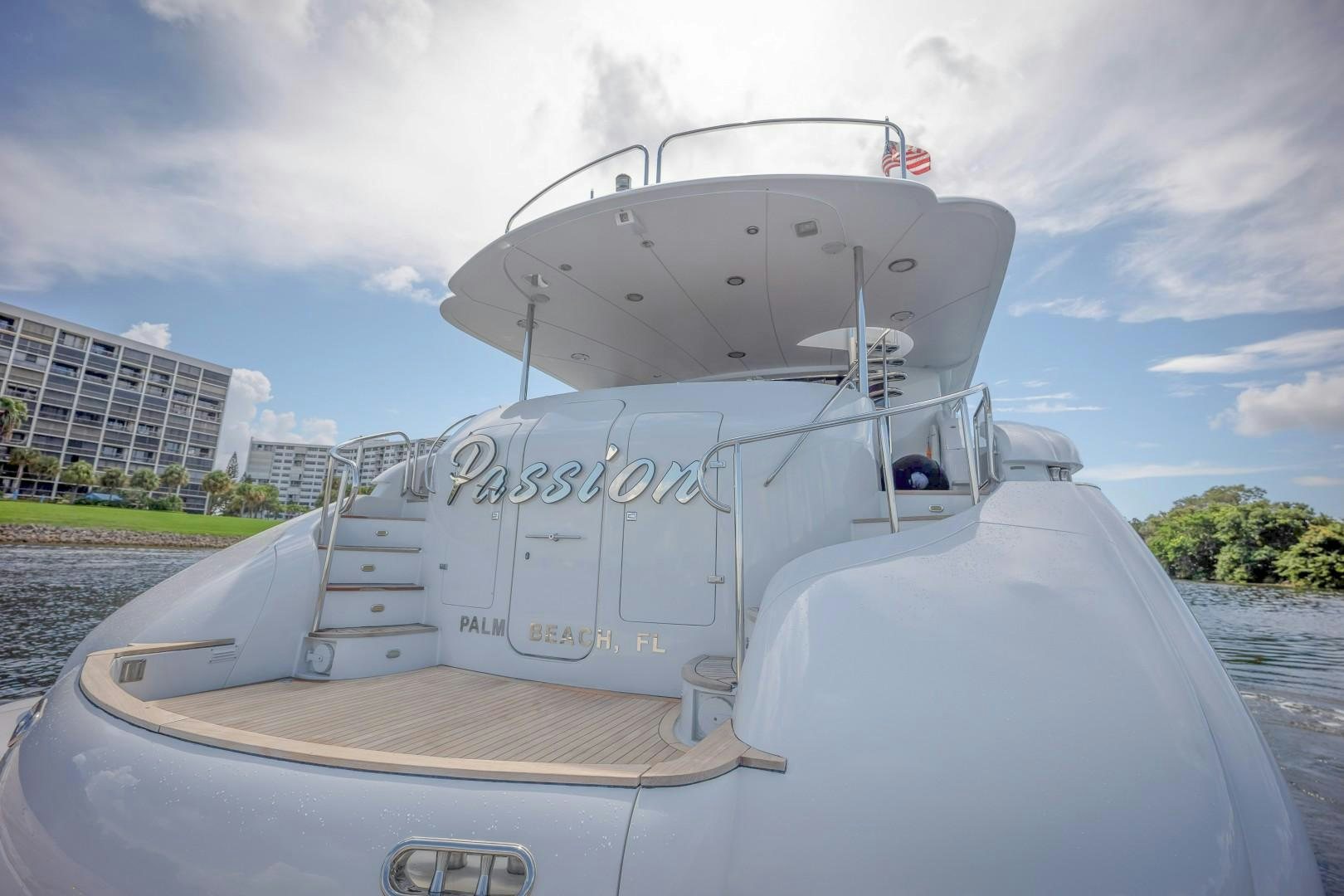 a white boat on a beach aboard PASSION Yacht for Sale