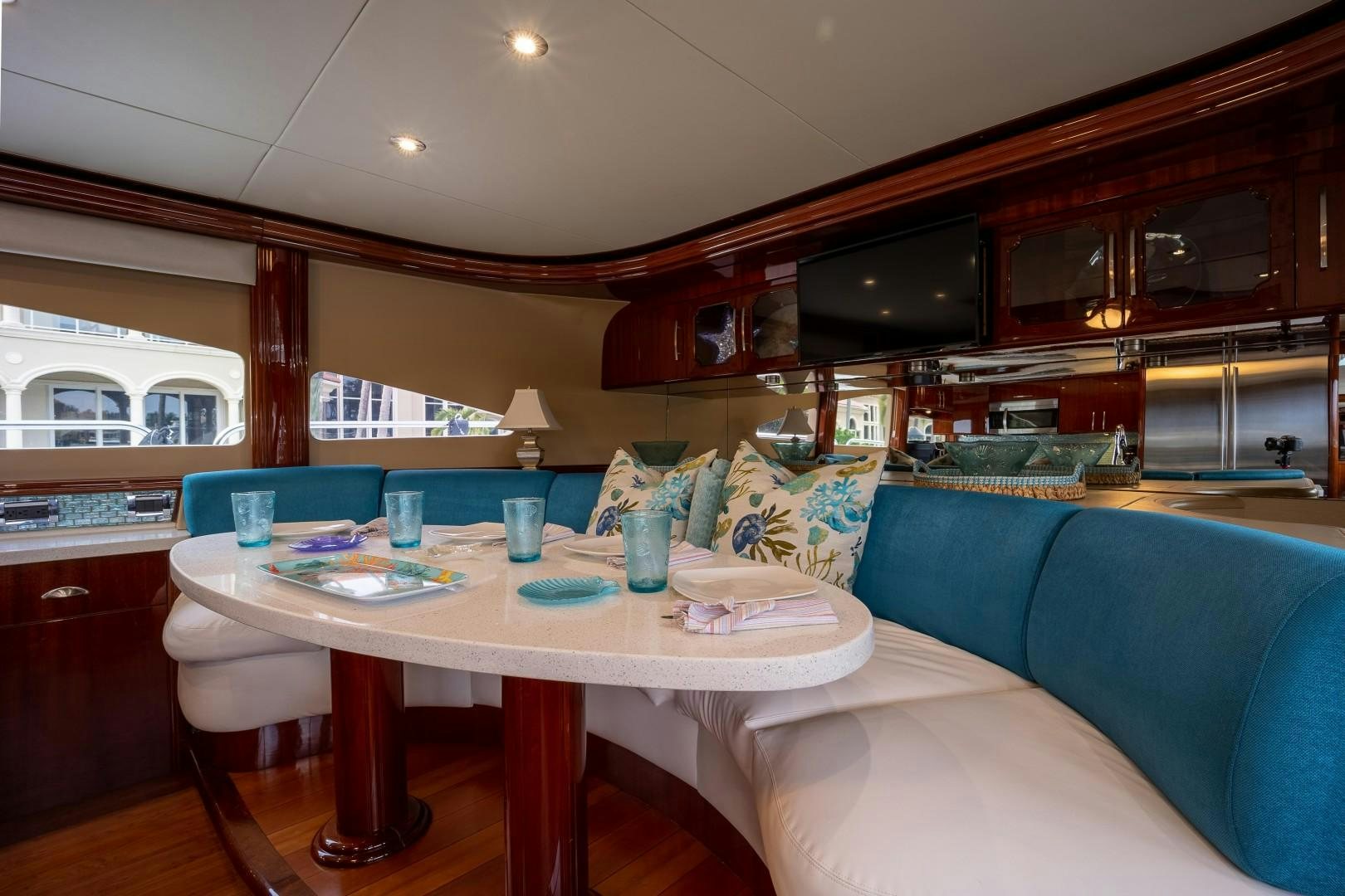 a living room with a table and chairs aboard PASSION Yacht for Sale