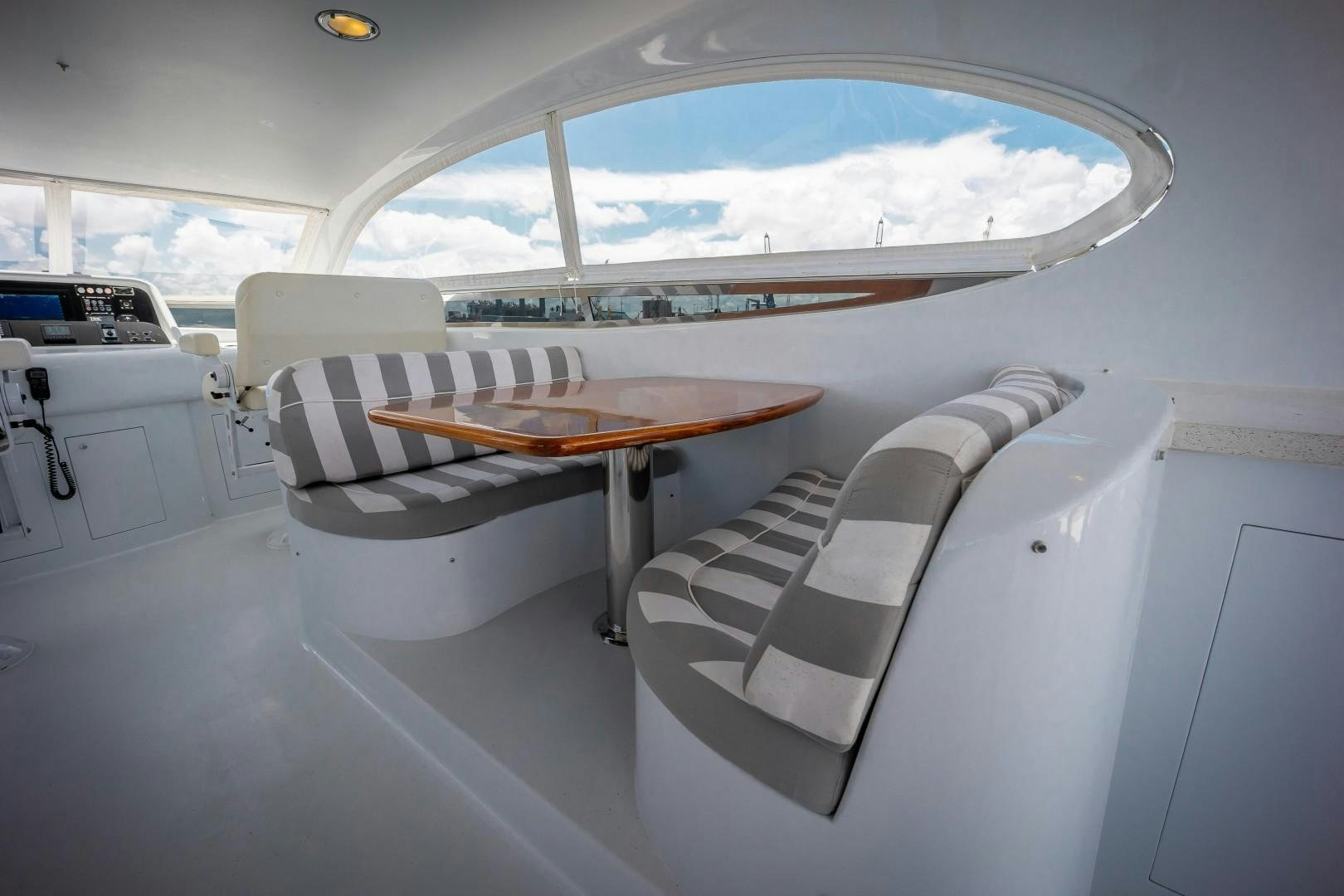 a room with a table and chairs aboard PASSION Yacht for Sale