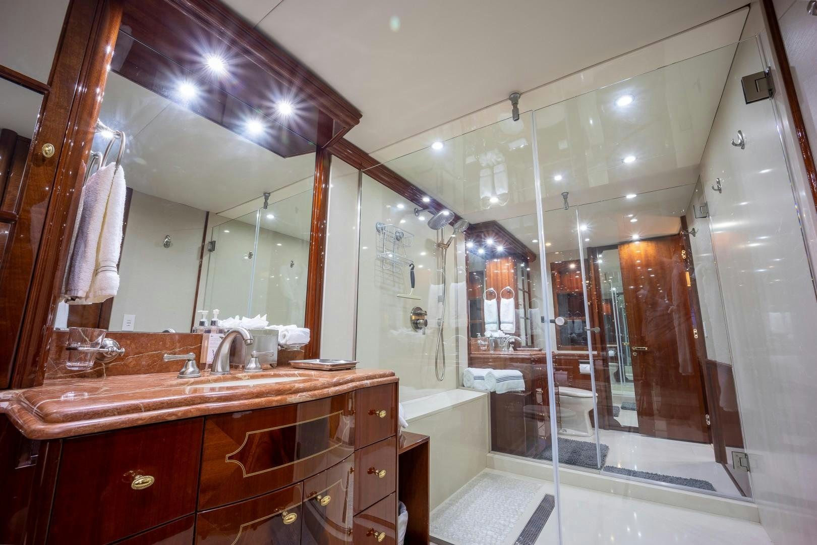 a bathroom with a large mirror aboard PASSION Yacht for Sale