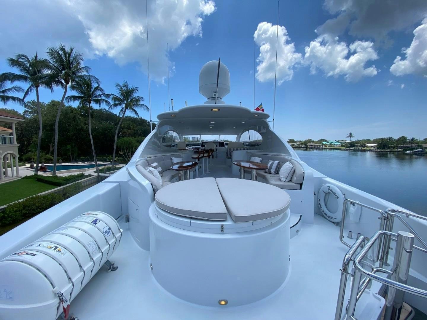 a white boat on a body of water aboard PASSION Yacht for Sale