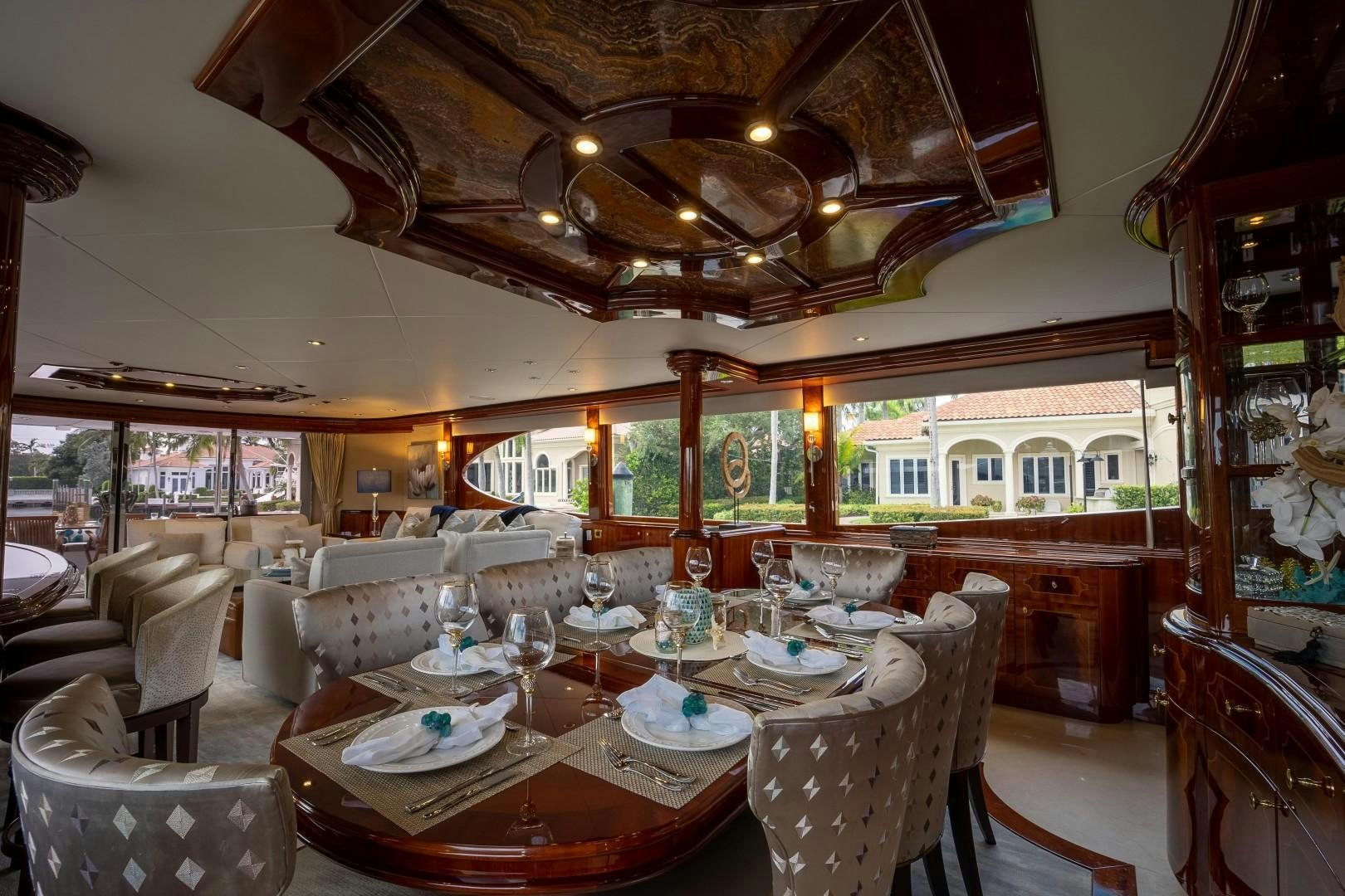 a large dining room with a large chandelier aboard PASSION Yacht for Sale