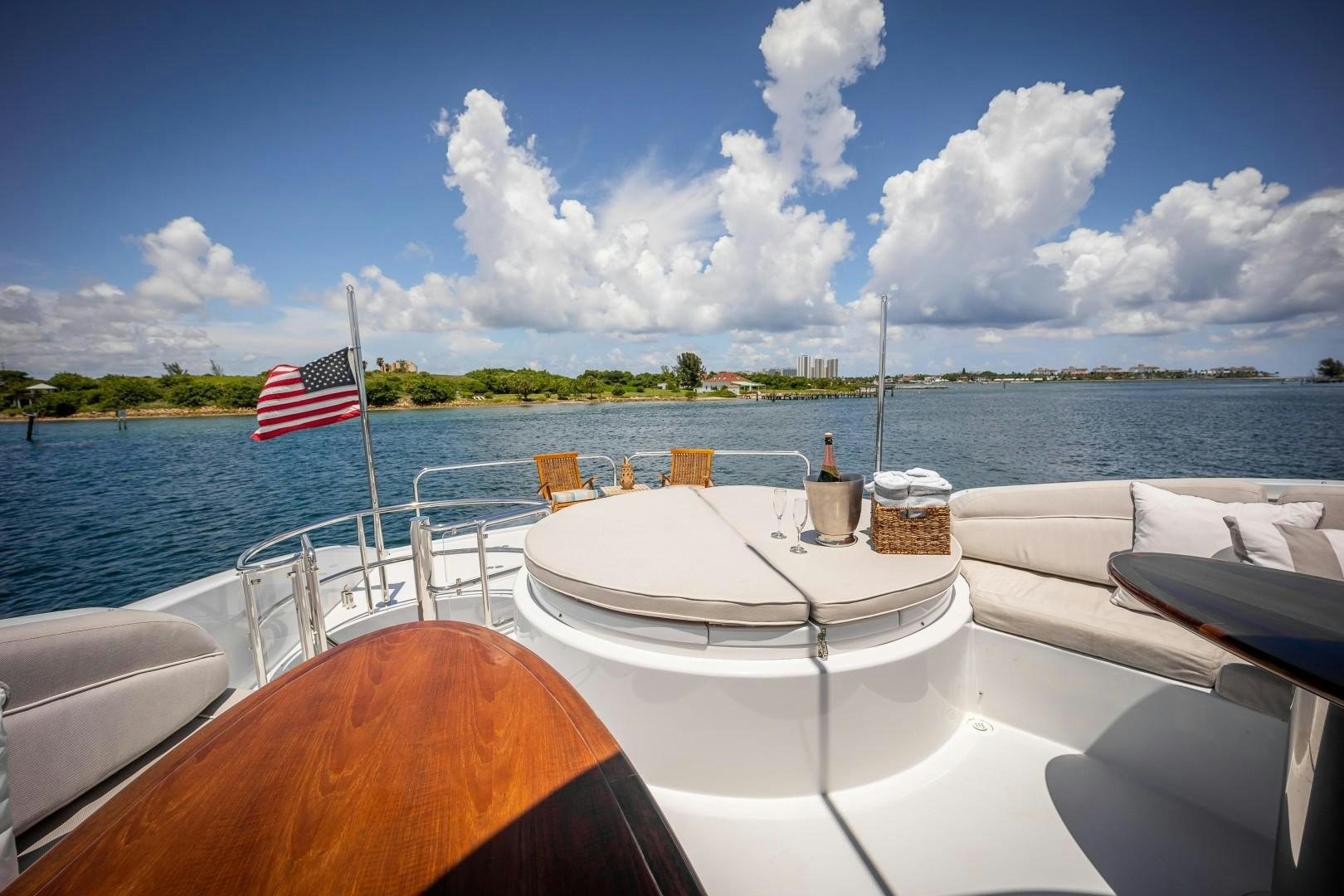 a boat with a flag on the front aboard PASSION Yacht for Sale