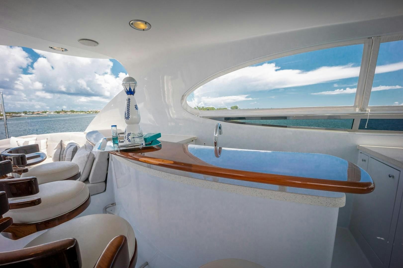 a boat with a bottle on the water aboard PASSION Yacht for Sale