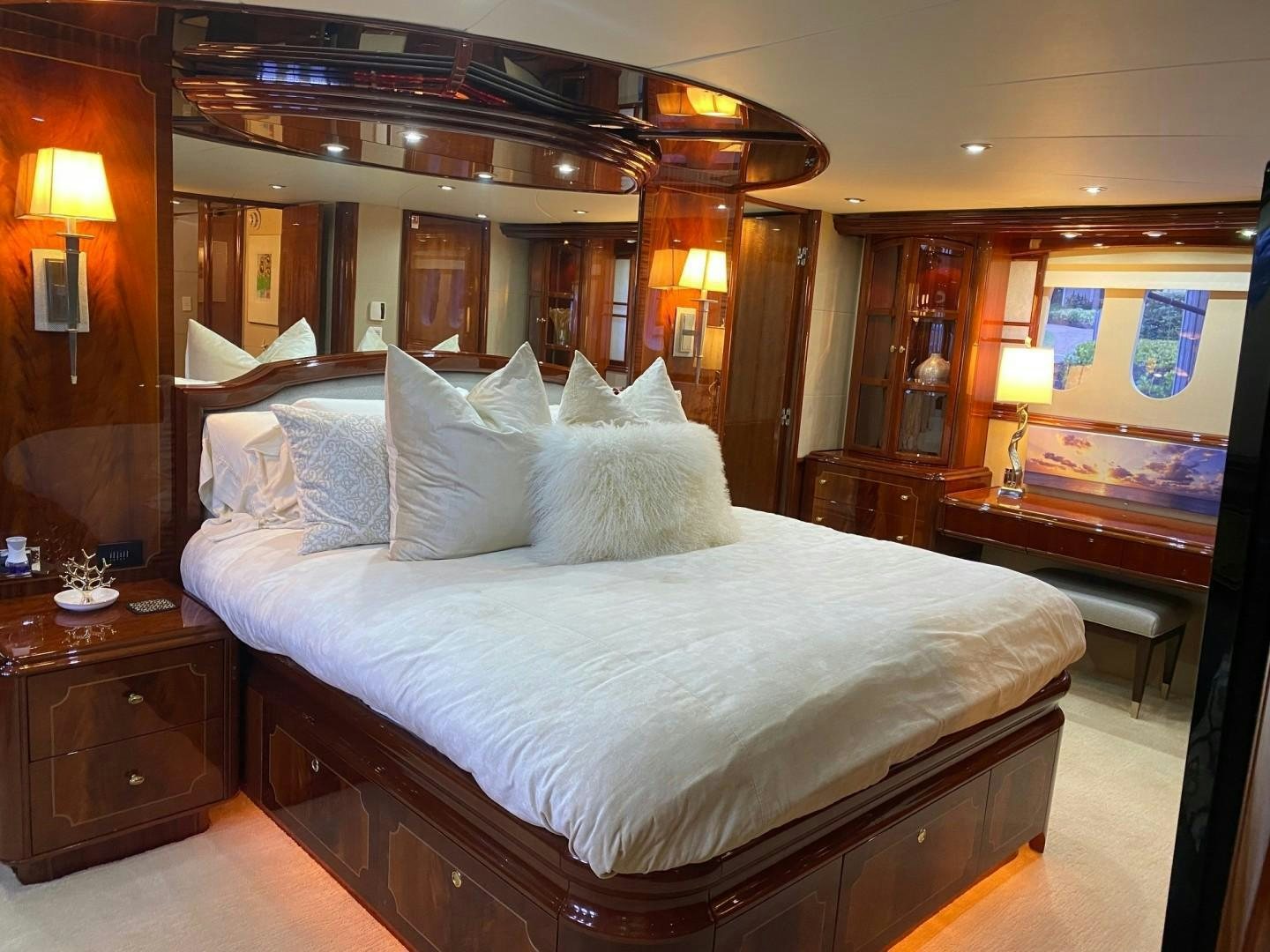 a bed with a white comforter aboard PASSION Yacht for Sale
