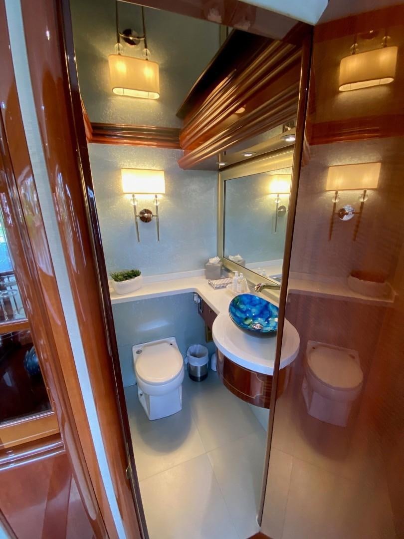 a bathroom with a tub sink and toilet aboard PASSION Yacht for Sale