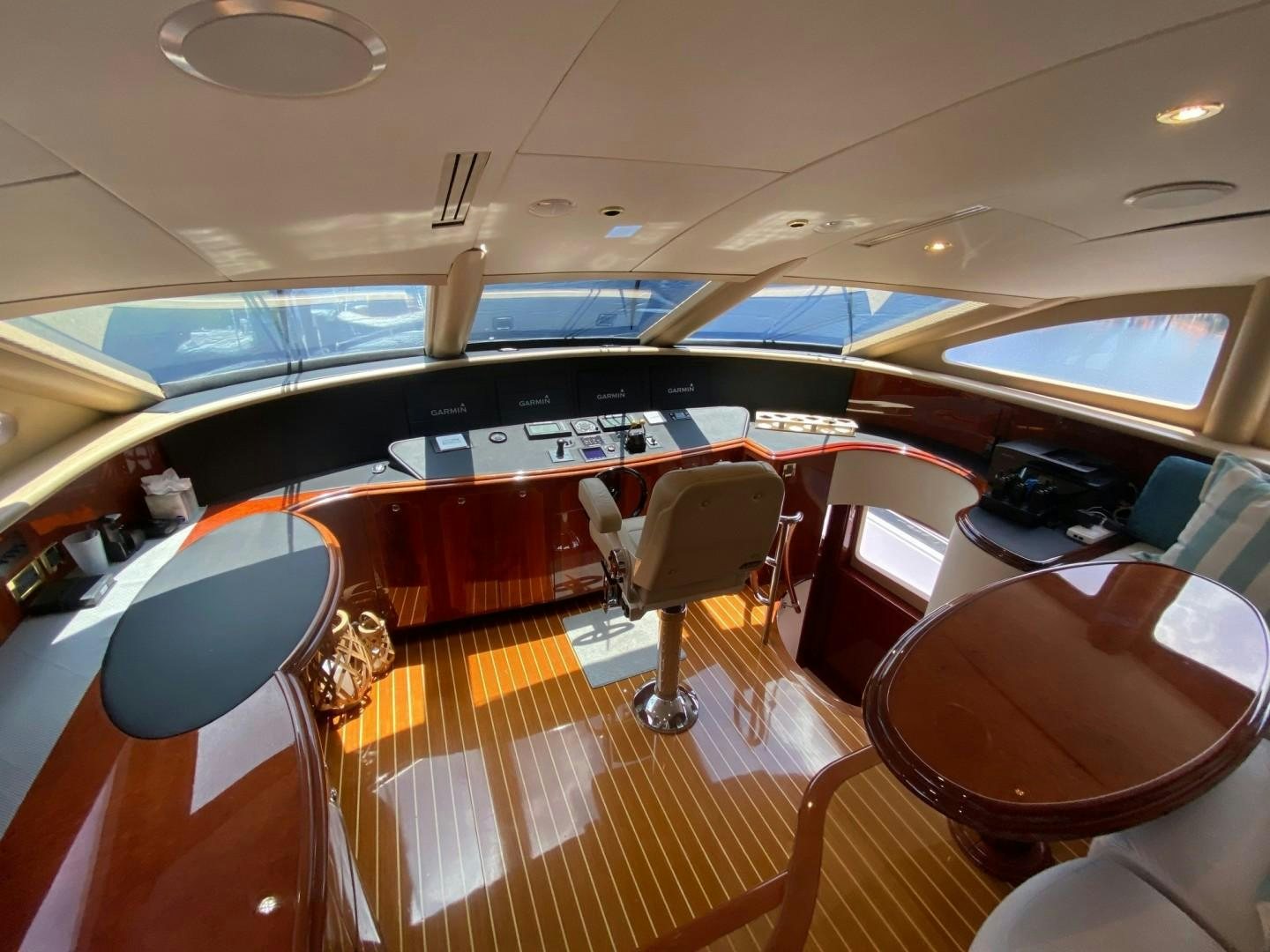 inside of a vehicle with chairs and tables and a large window aboard PASSION Yacht for Sale