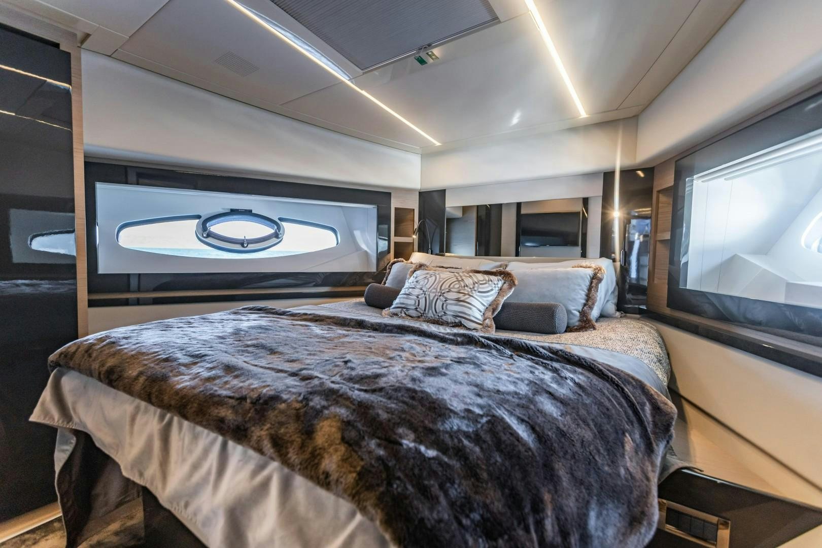 a bedroom with a large bed aboard Q80 Yacht for Sale