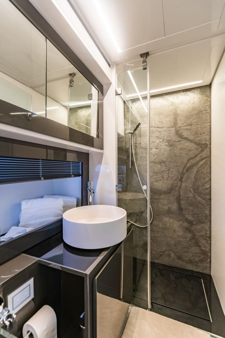a bathroom with a shower and a toilet aboard Q80 Yacht for Sale