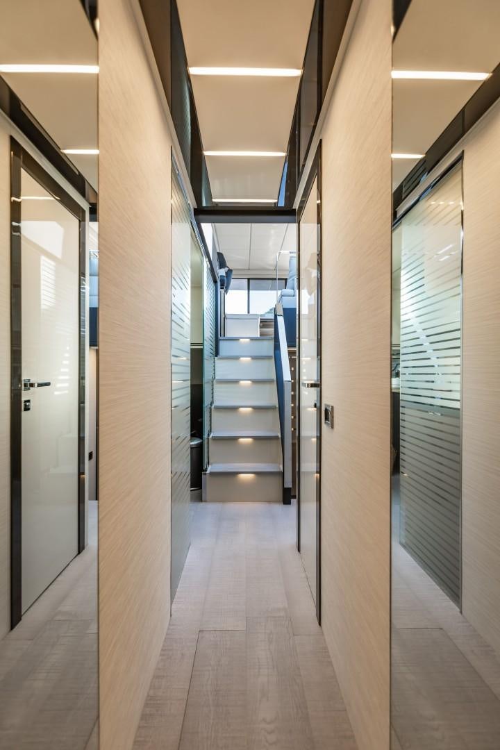 a hallway with several doors aboard Q80 Yacht for Sale