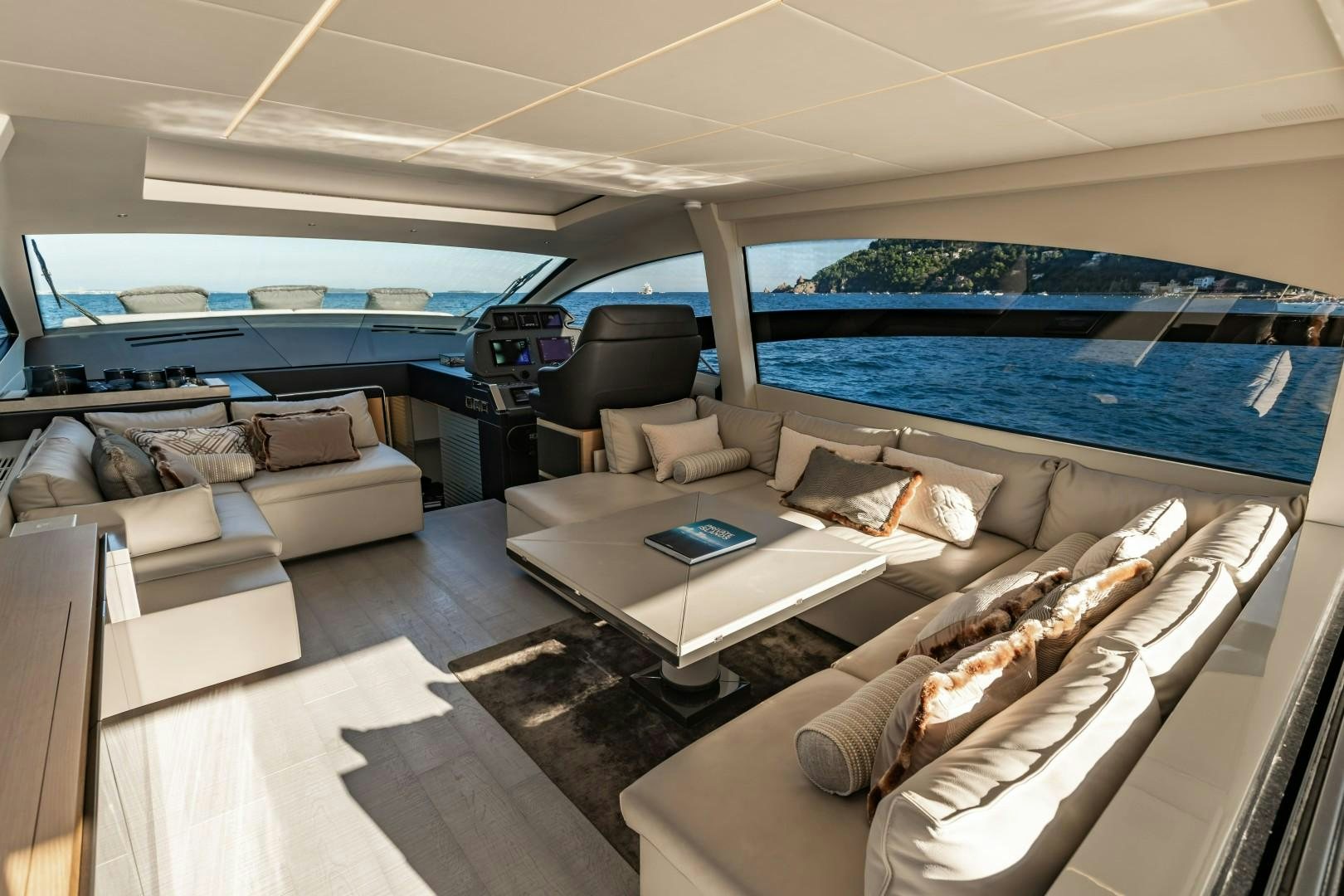 a living room with a large window aboard Q80 Yacht for Sale