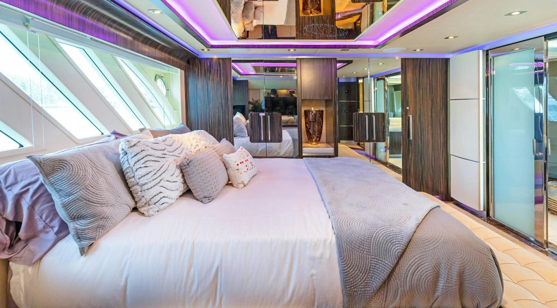 a bed with pillows on it aboard CASUAL Yacht for Sale