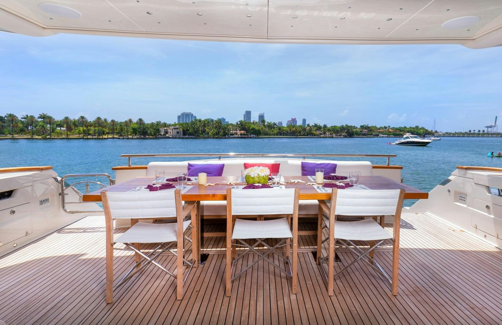 a table set for a dinner party aboard CASUAL Yacht for Sale