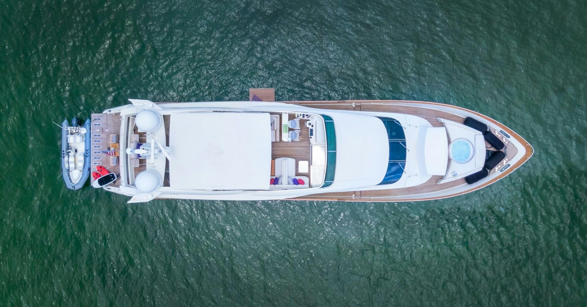 a small boat on a green lawn aboard CASUAL Yacht for Sale