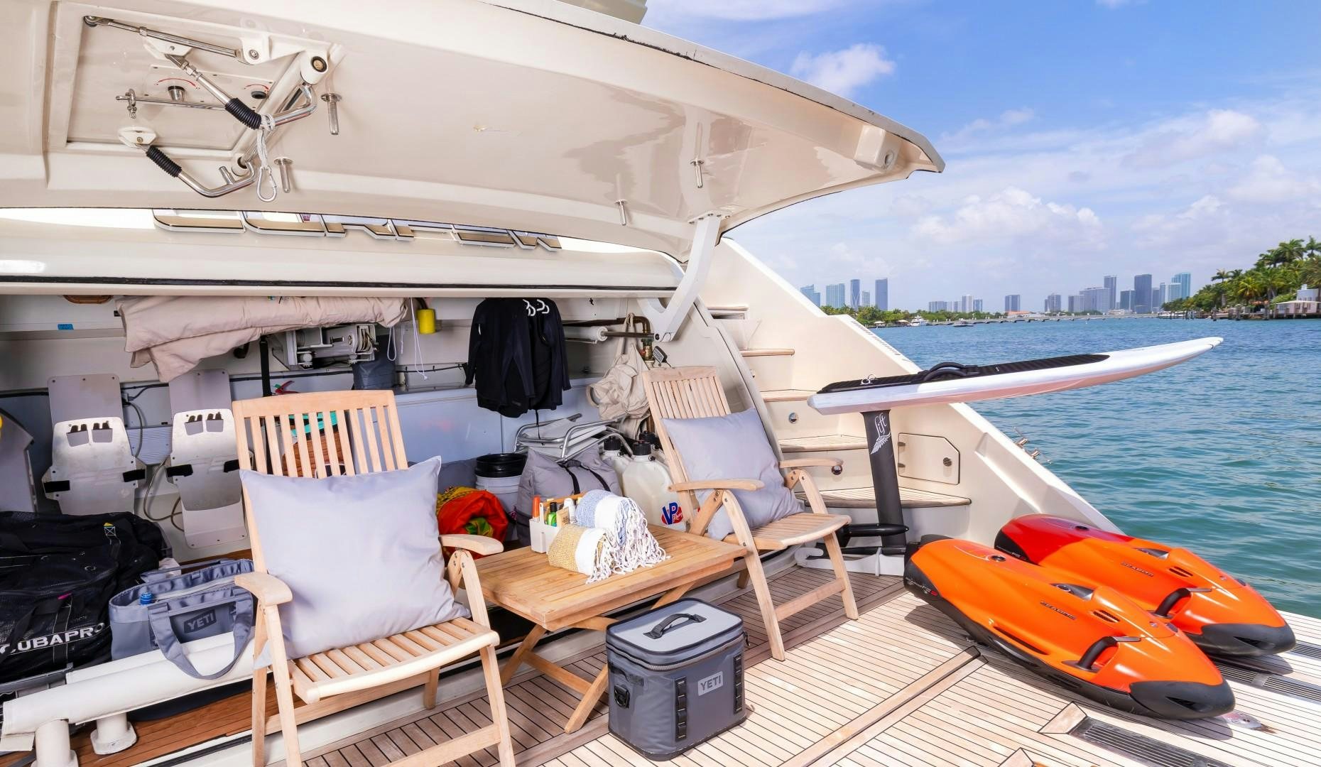 a boat with a table and chairs on it aboard CASUAL Yacht for Sale