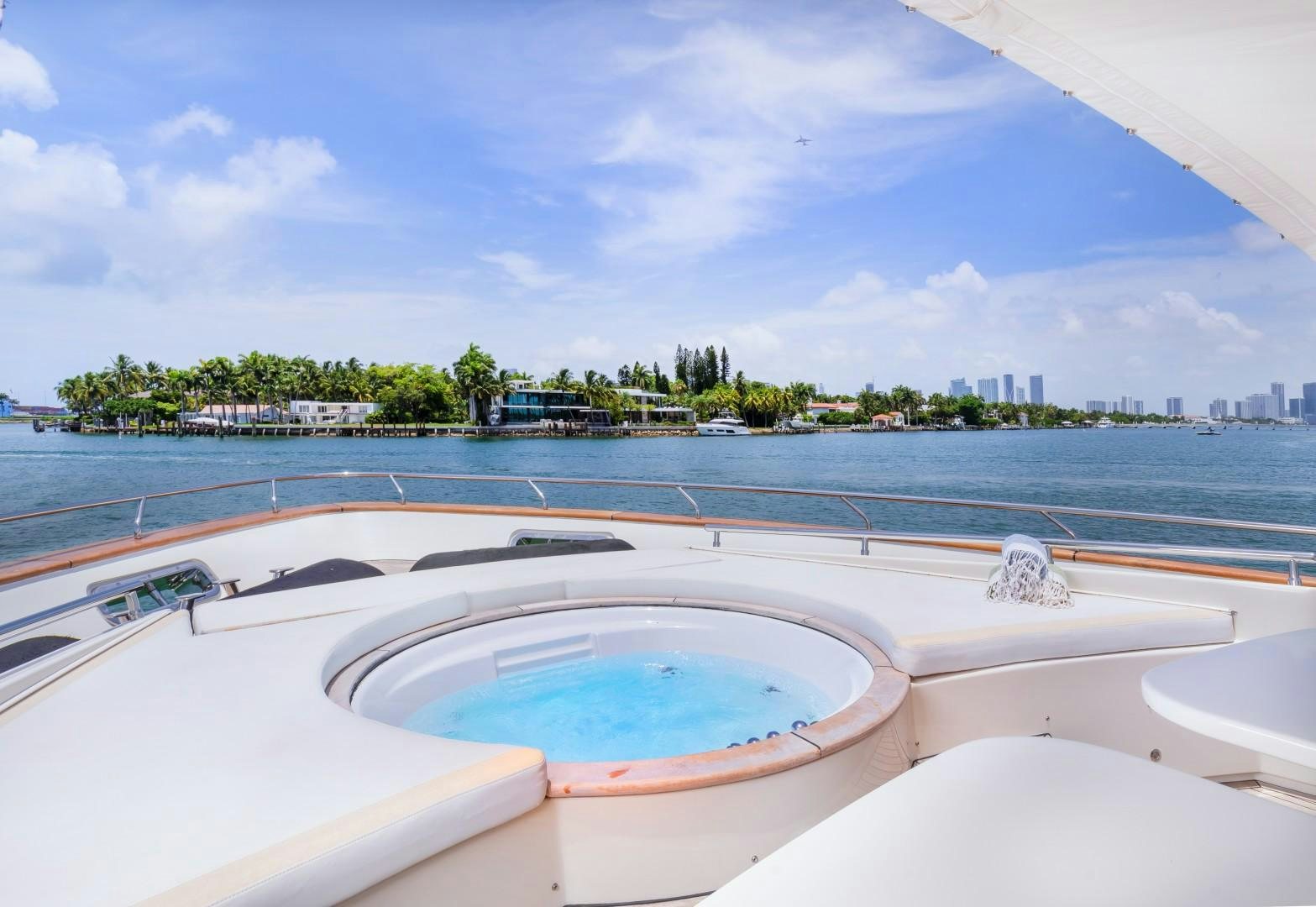 a pool with a city in the background aboard CASUAL Yacht for Sale