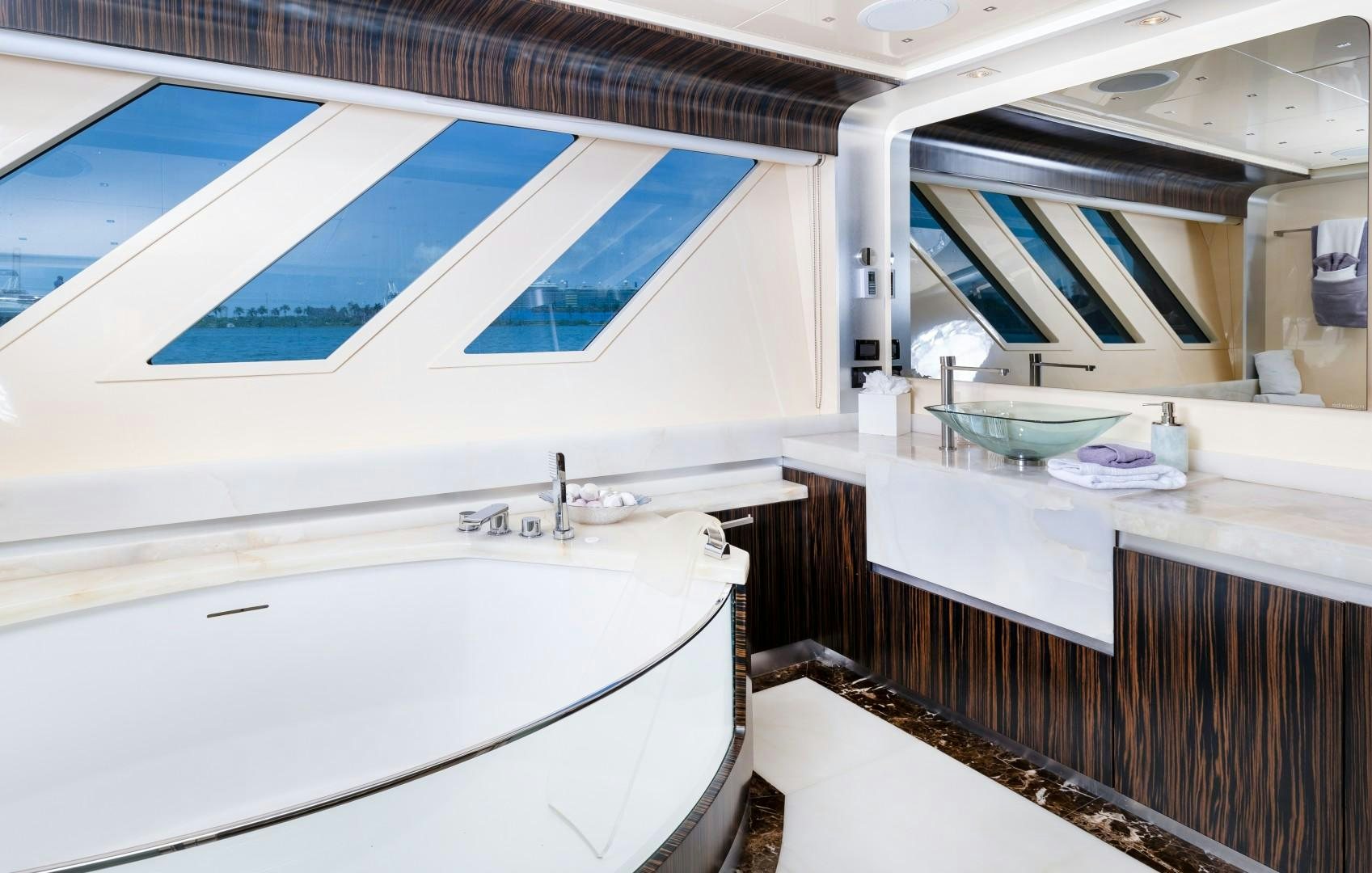 a bathroom with a sink and a tub aboard CASUAL Yacht for Sale