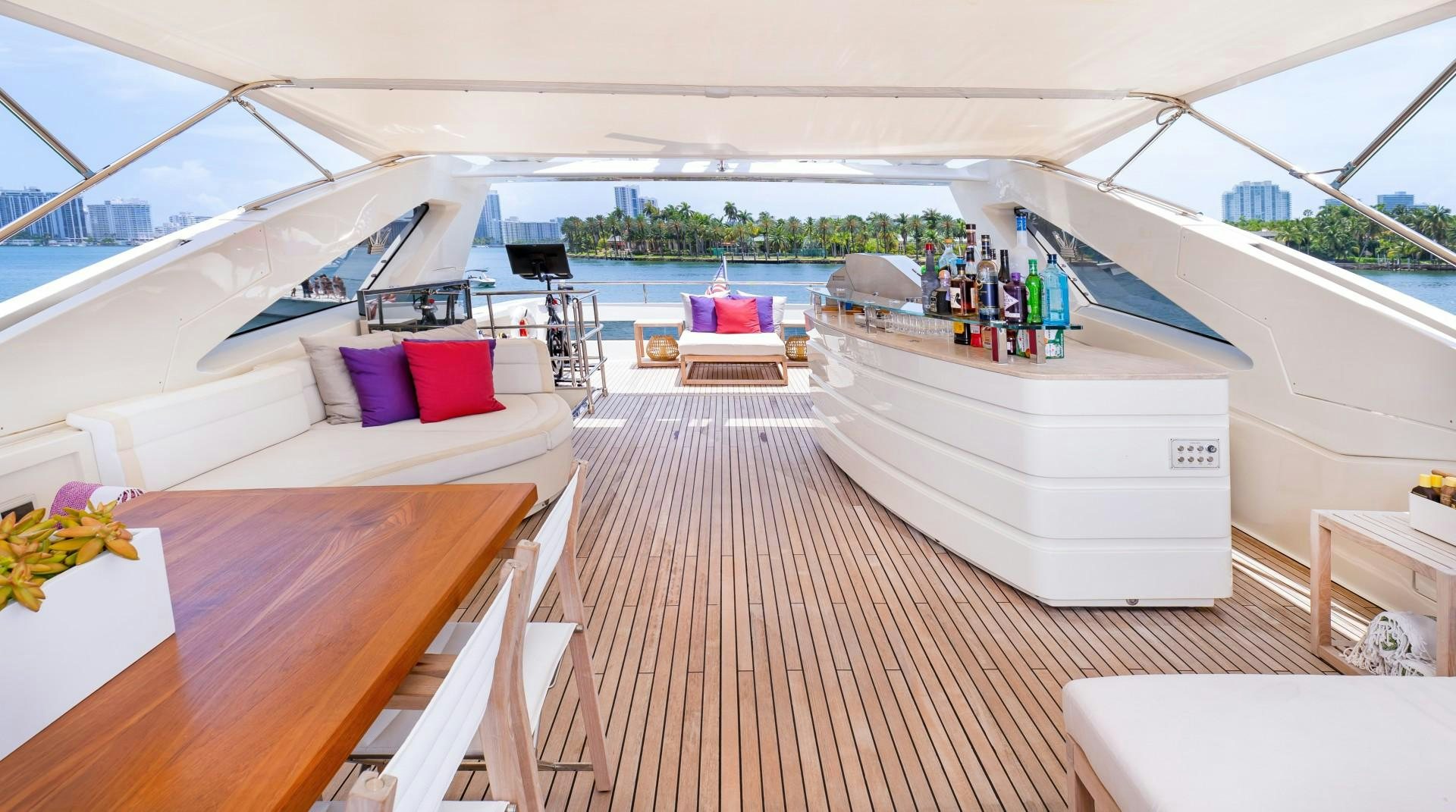 a room with a bed and a table and a pool aboard CASUAL Yacht for Sale