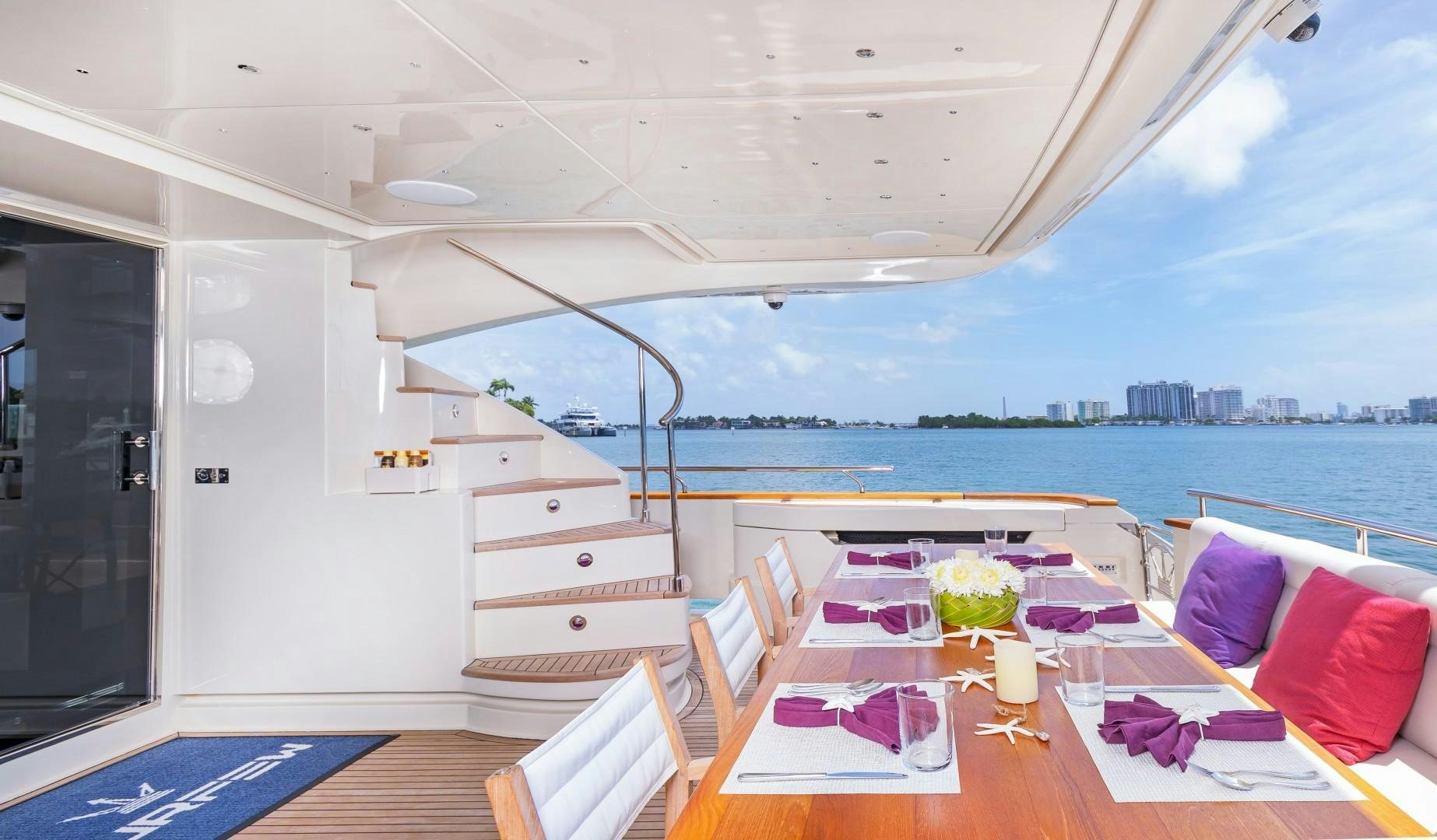 a room with a table and chairs aboard CASUAL Yacht for Sale