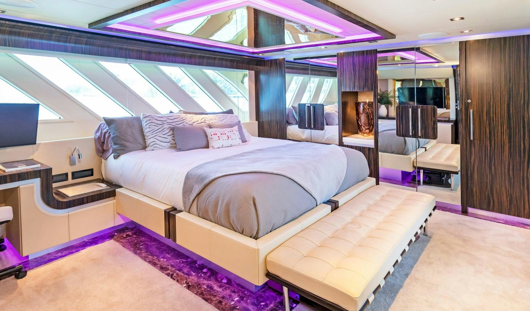 a room with a bed and a desk aboard CASUAL Yacht for Sale