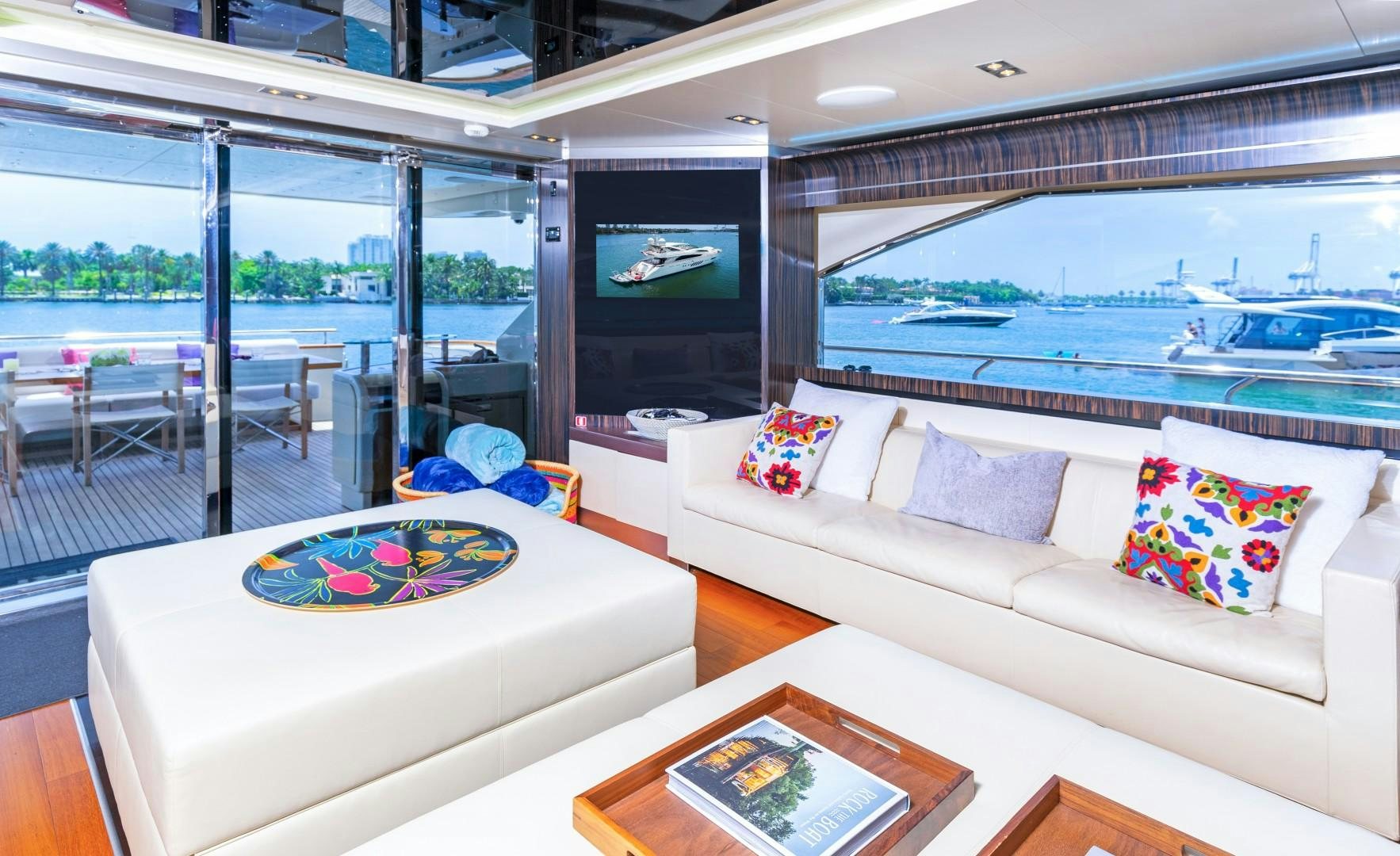 a living room with a large window aboard CASUAL Yacht for Sale