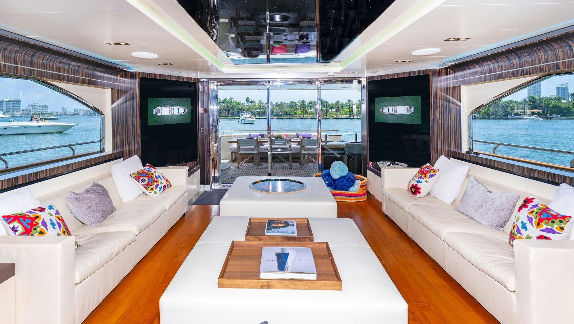 a living room with a large glass window aboard CASUAL Yacht for Sale