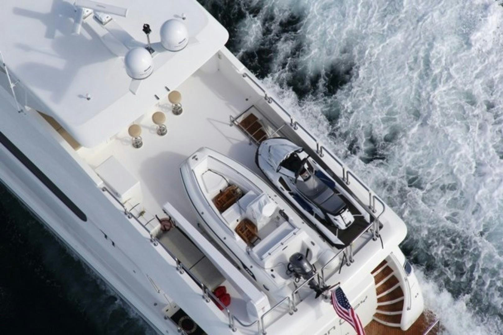 a helicopter flying over a snowy landscape aboard CARBON COPY Yacht for Sale