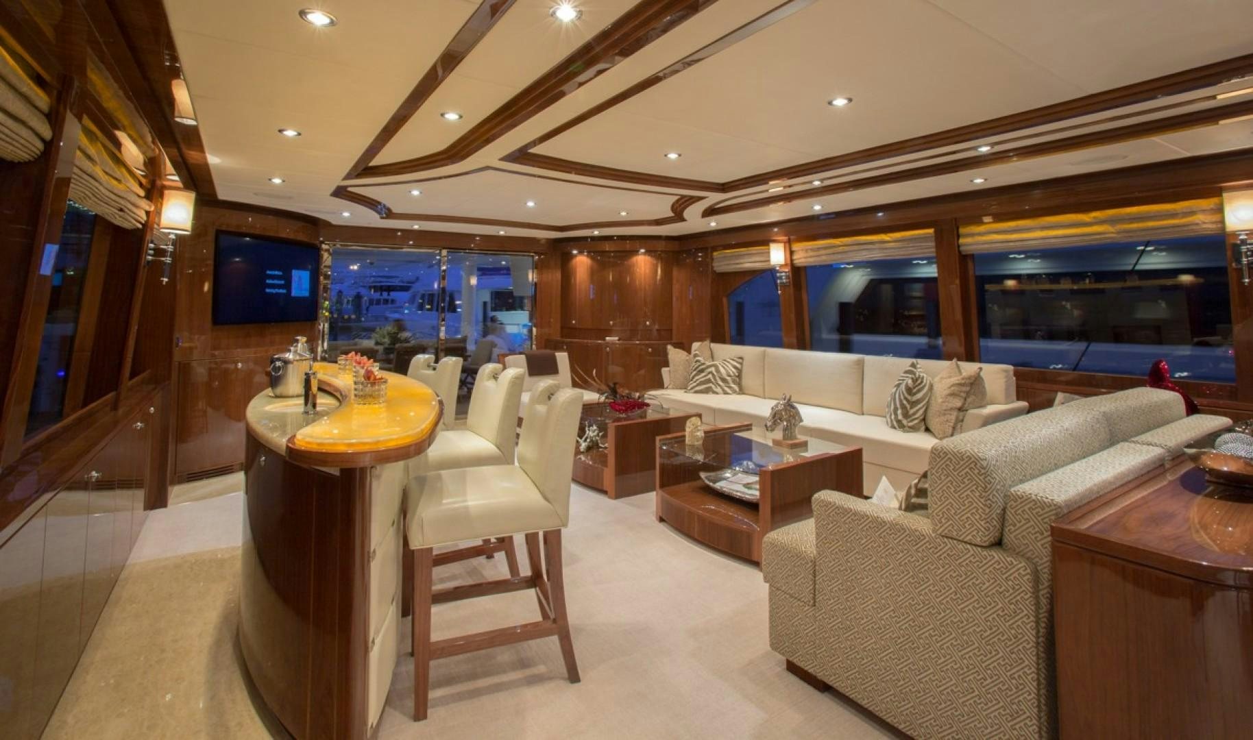 a room with a couch and a table and a tv aboard CARBON COPY Yacht for Sale