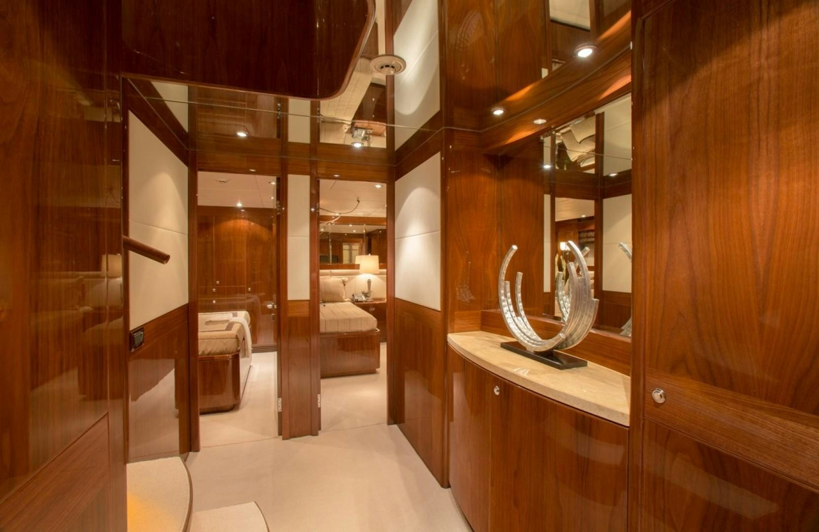 a room with a large mirror and a table aboard CARBON COPY Yacht for Sale