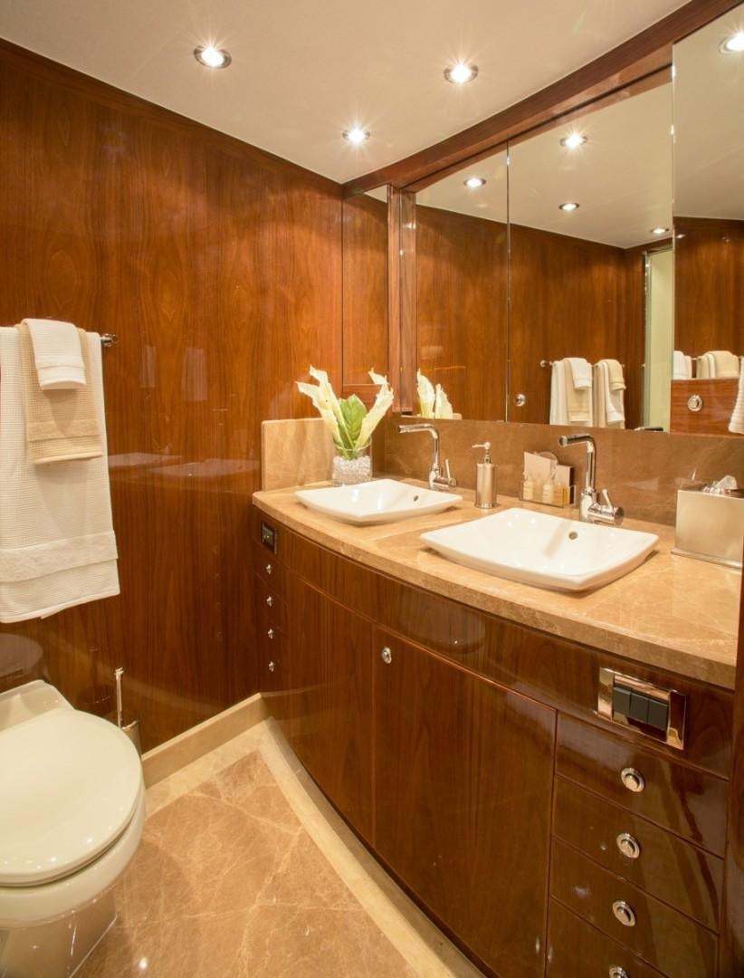 a bathroom with a sink and a toilet aboard CARBON COPY Yacht for Sale