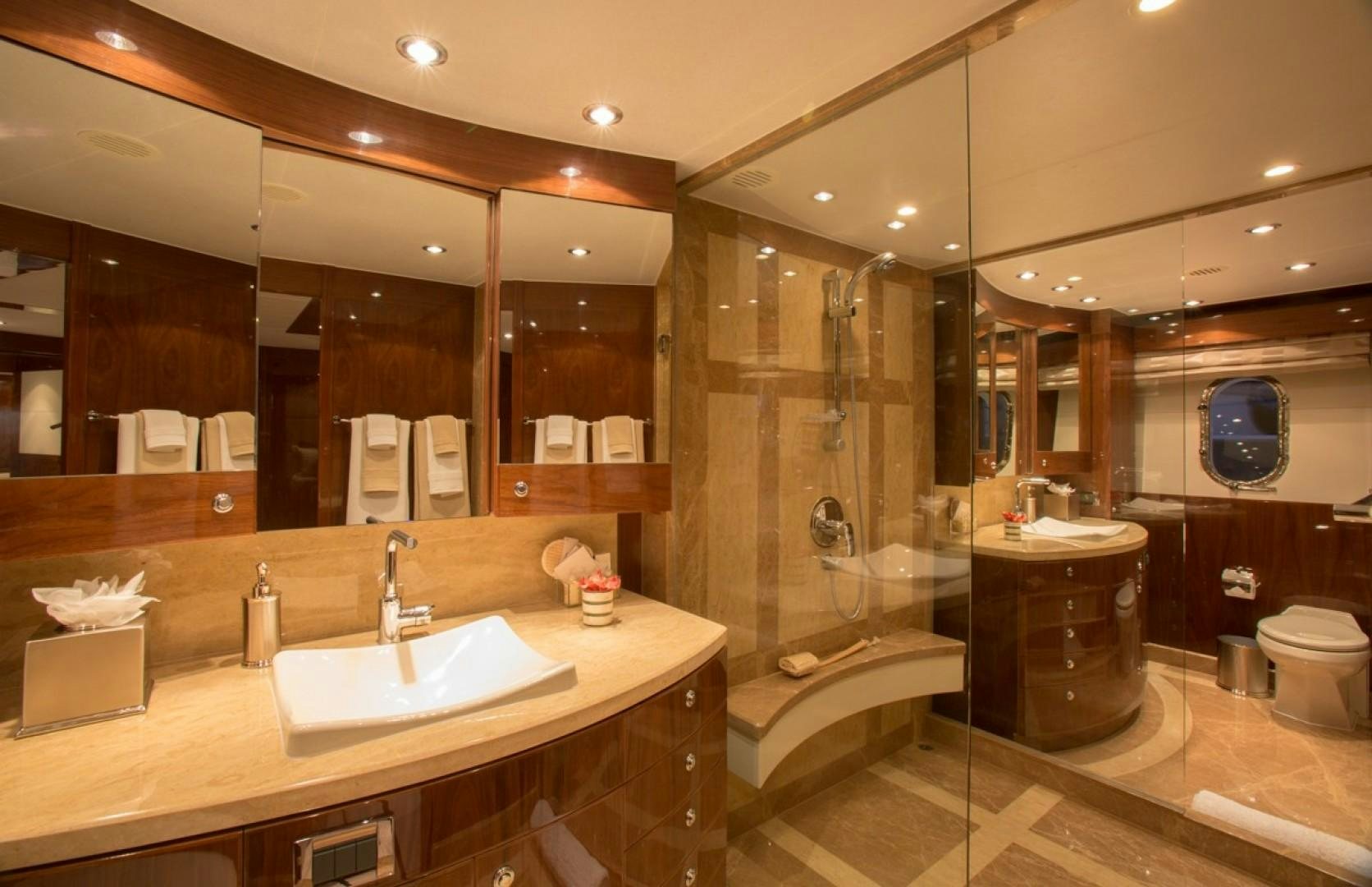 a bathroom with a large mirror aboard CARBON COPY Yacht for Sale