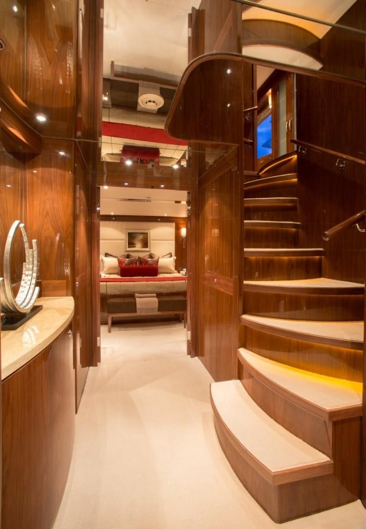 a room with a bed and a mirror aboard CARBON COPY Yacht for Sale