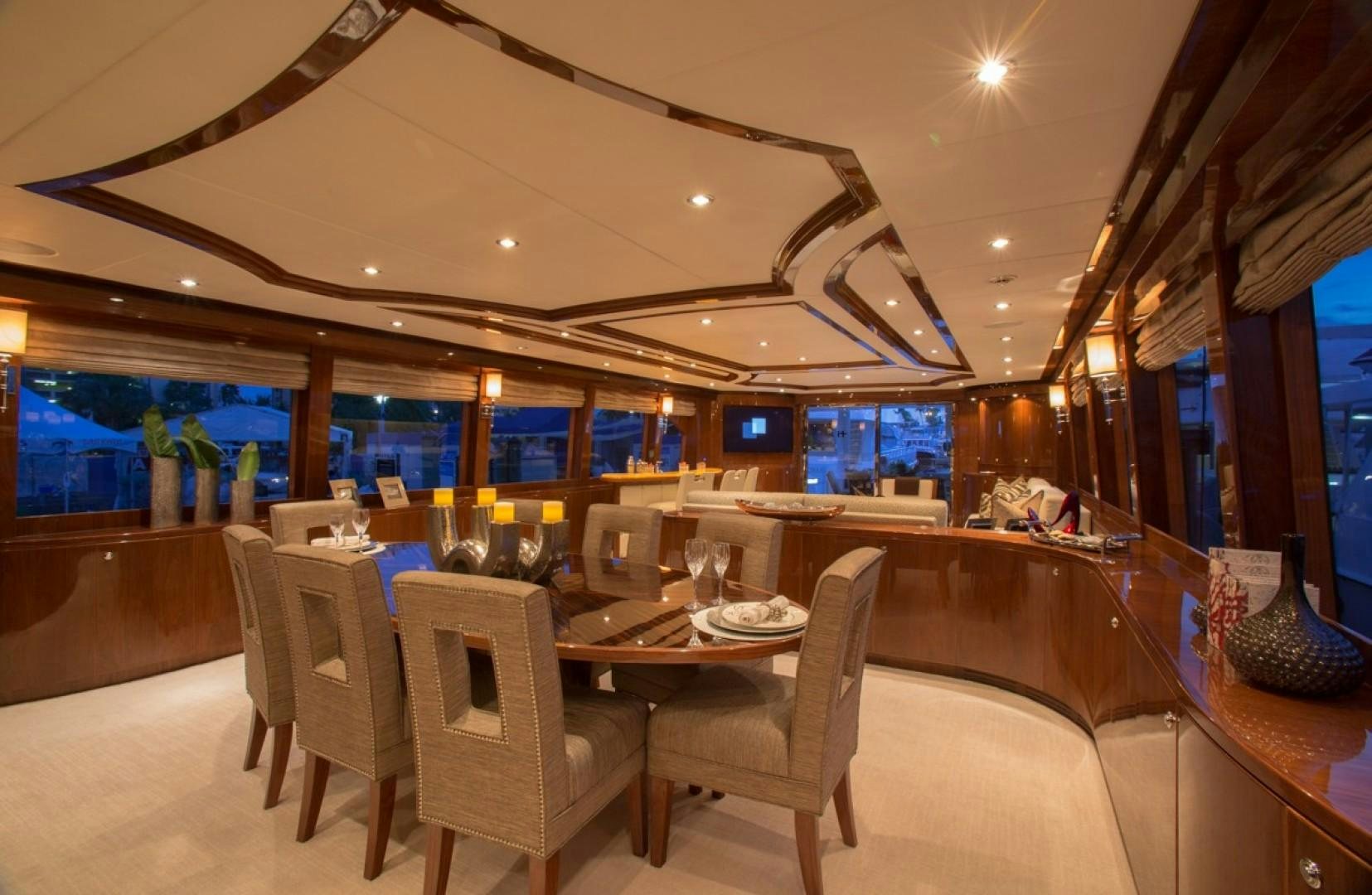 a room with a table and chairs aboard CARBON COPY Yacht for Sale