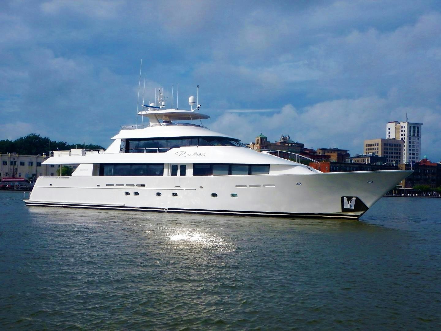 a large white boat in the water aboard REBELLIOUS Yacht for Sale