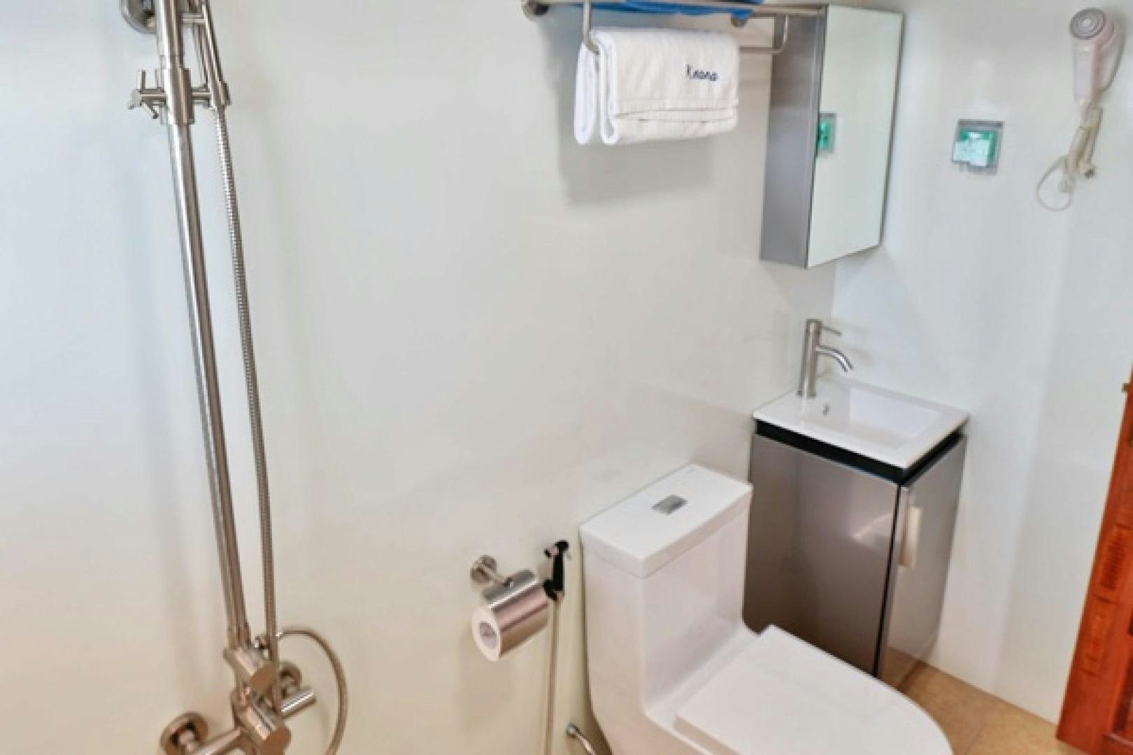 a bathroom with a toilet and sink aboard KEANA Yacht for Sale