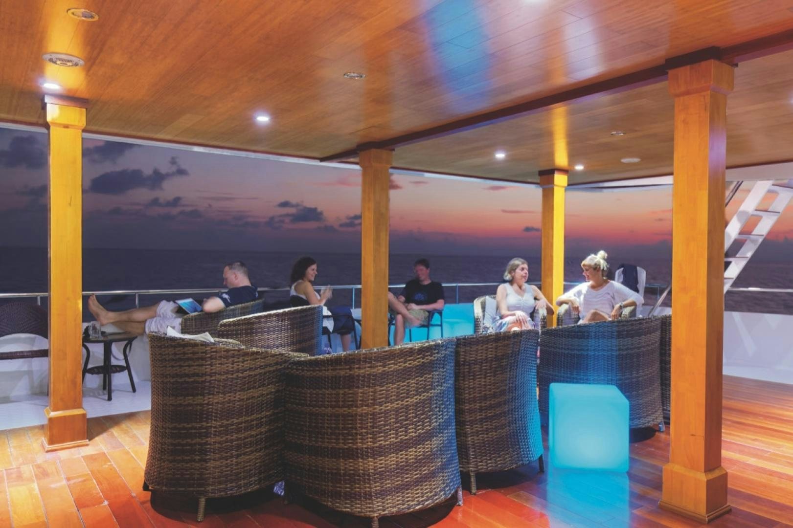 people sitting at a table aboard KEANA Yacht for Sale