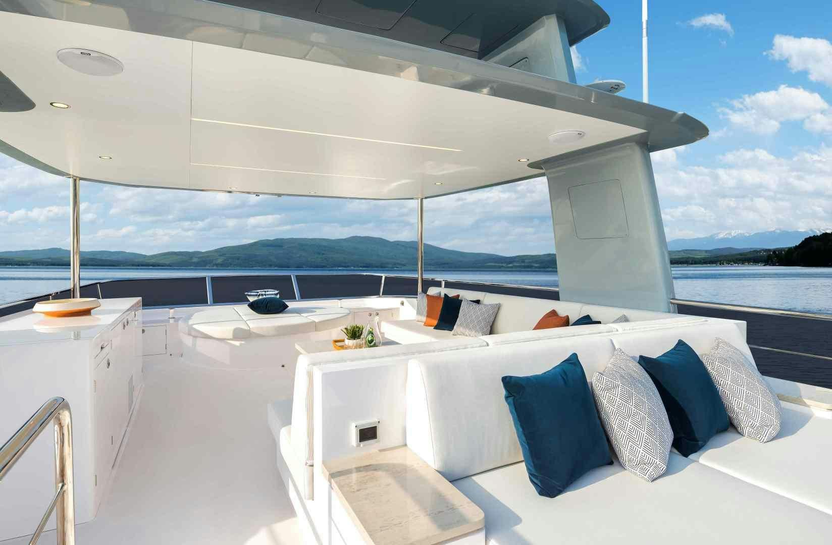 a room with a large white bed and a large window aboard FD110 006 Yacht for Sale