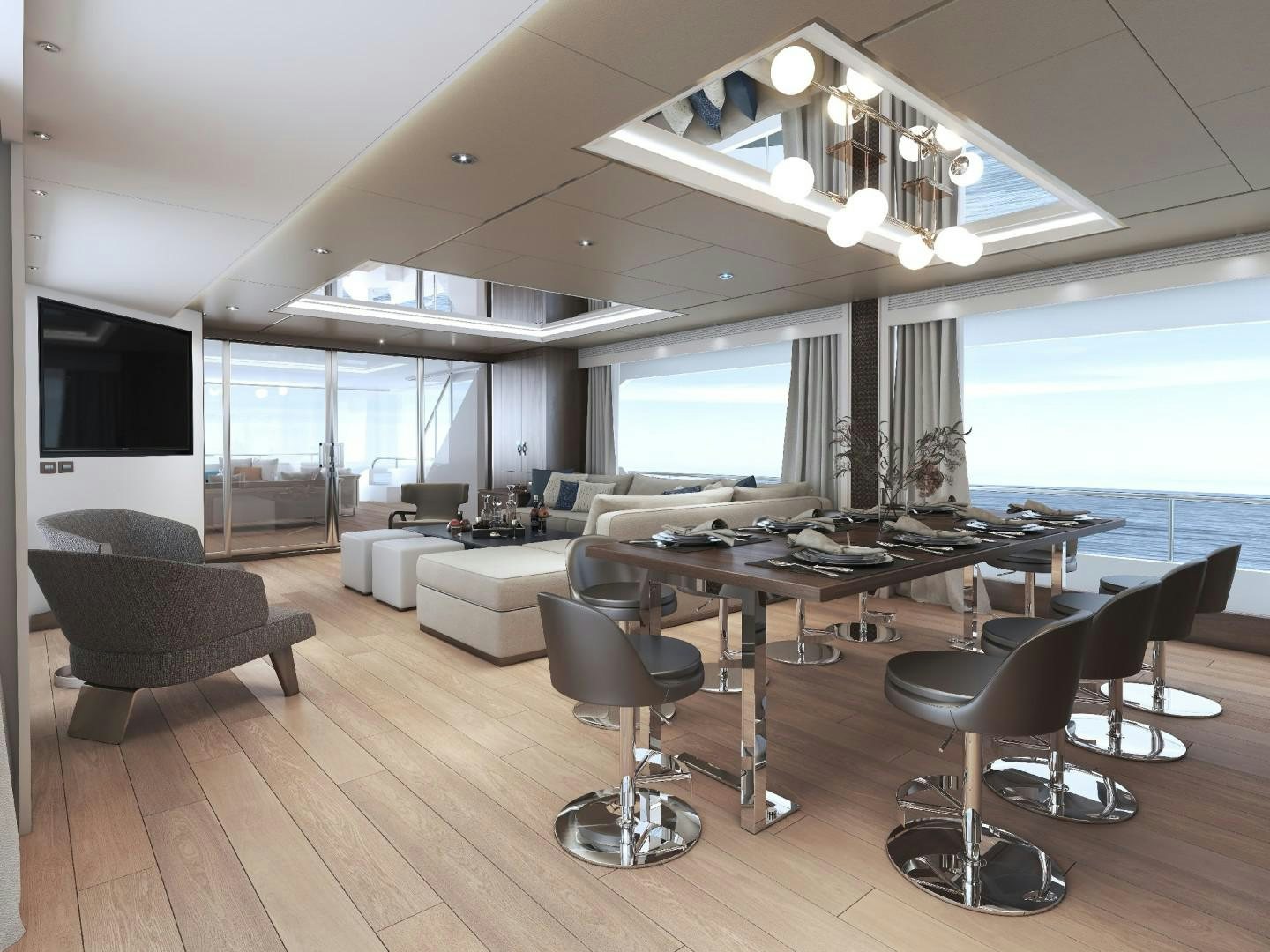 a room with a large window and a table with chairs and a large television screen aboard FD100 Yacht for Sale
