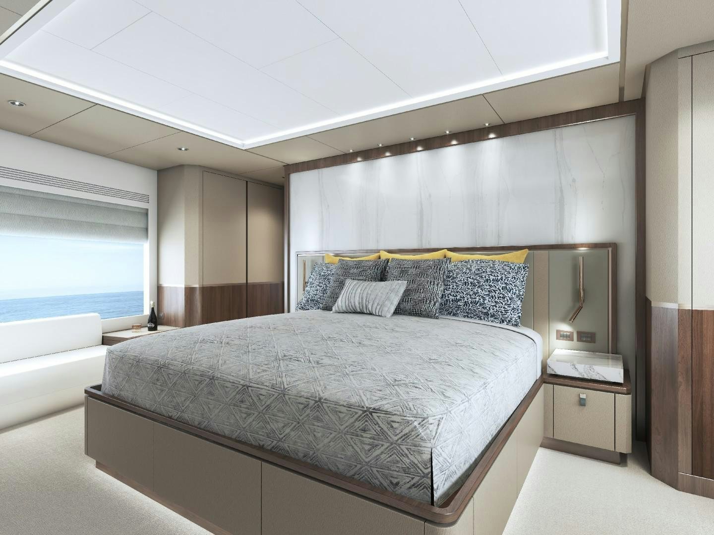 a bed with a white bed spread aboard FD100 Yacht for Sale