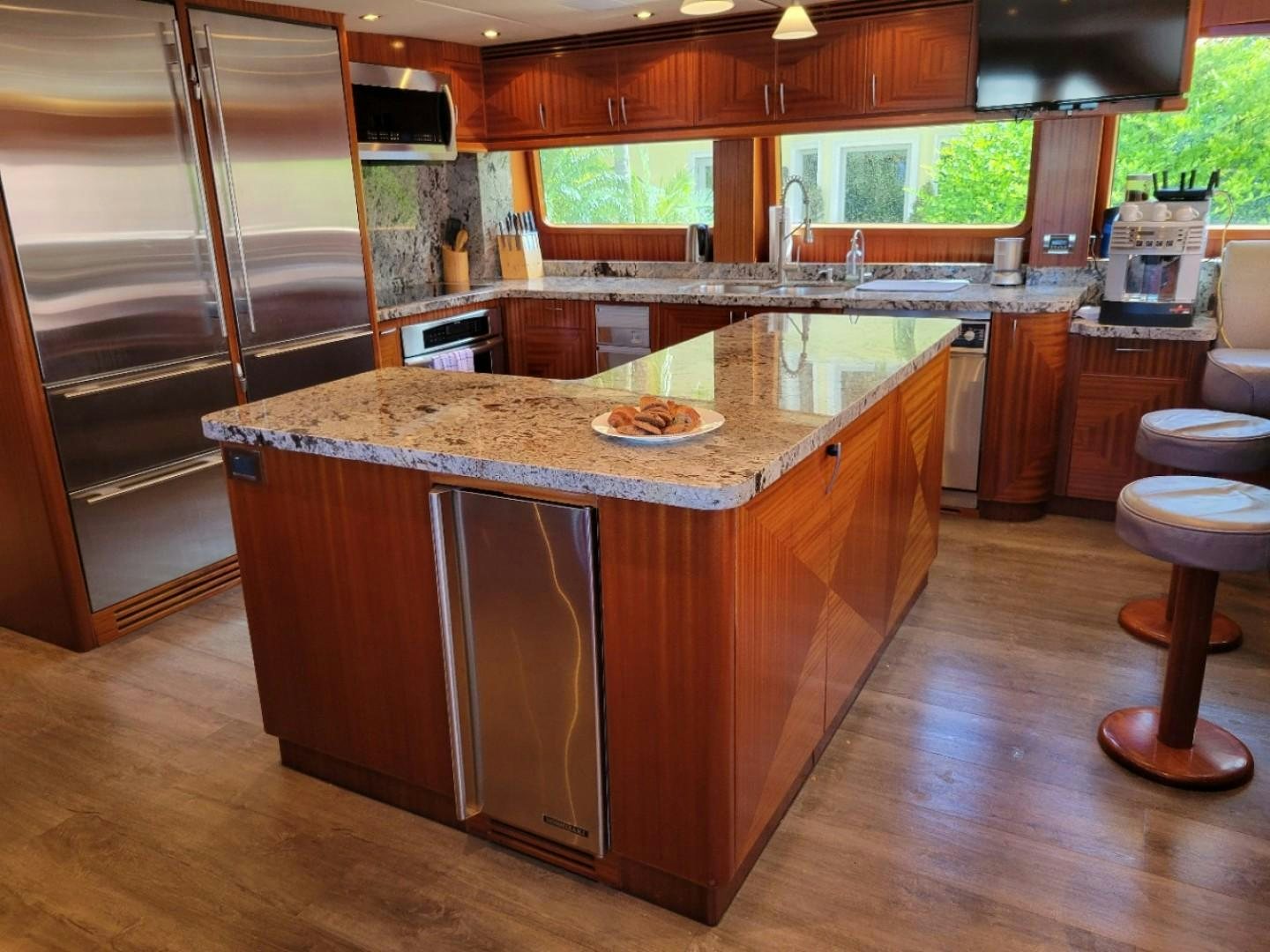 a kitchen with a large island aboard GLEN ELLEN Yacht for Sale