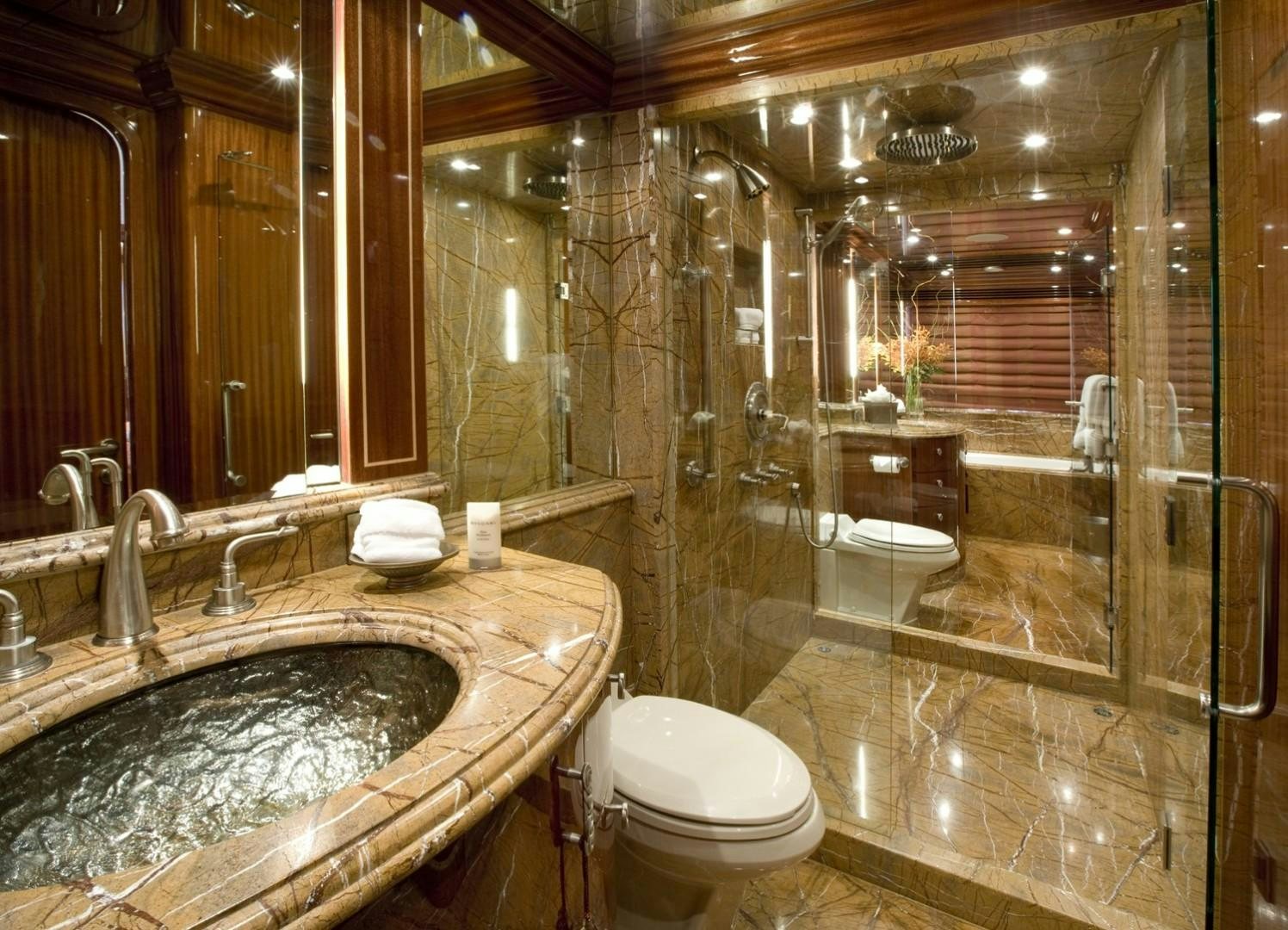a bathroom with a large mirror aboard GLEN ELLEN Yacht for Sale
