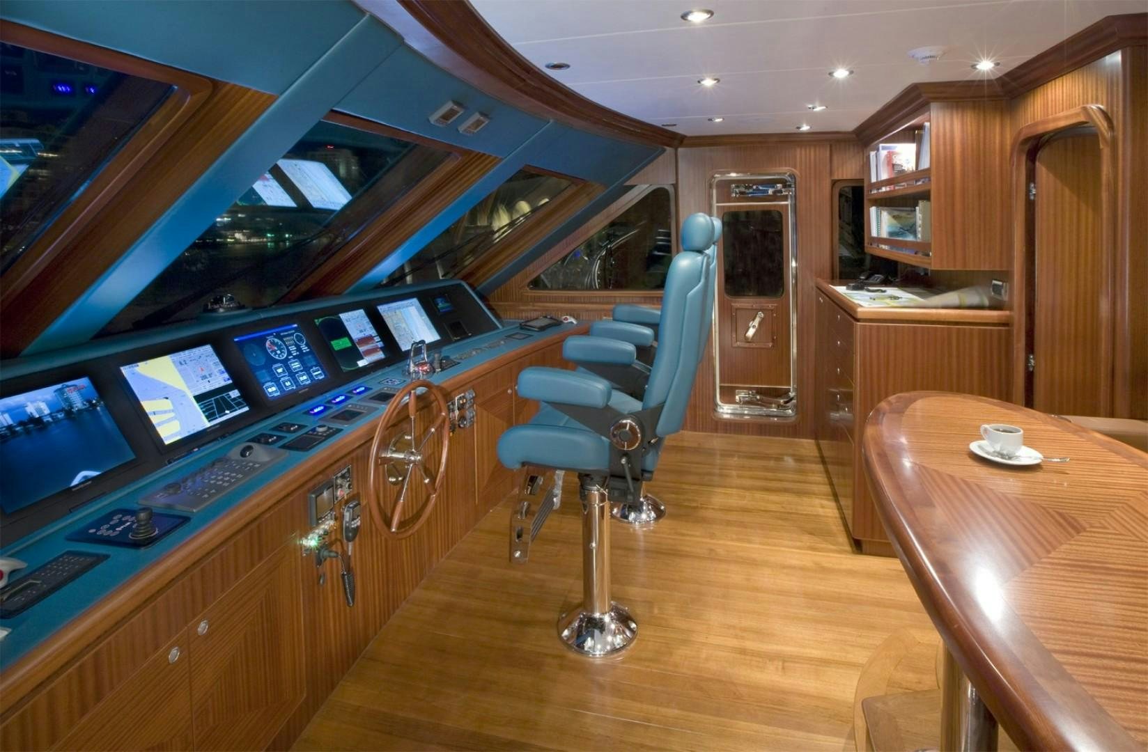 a room with a desk and chairs aboard GLEN ELLEN Yacht for Sale