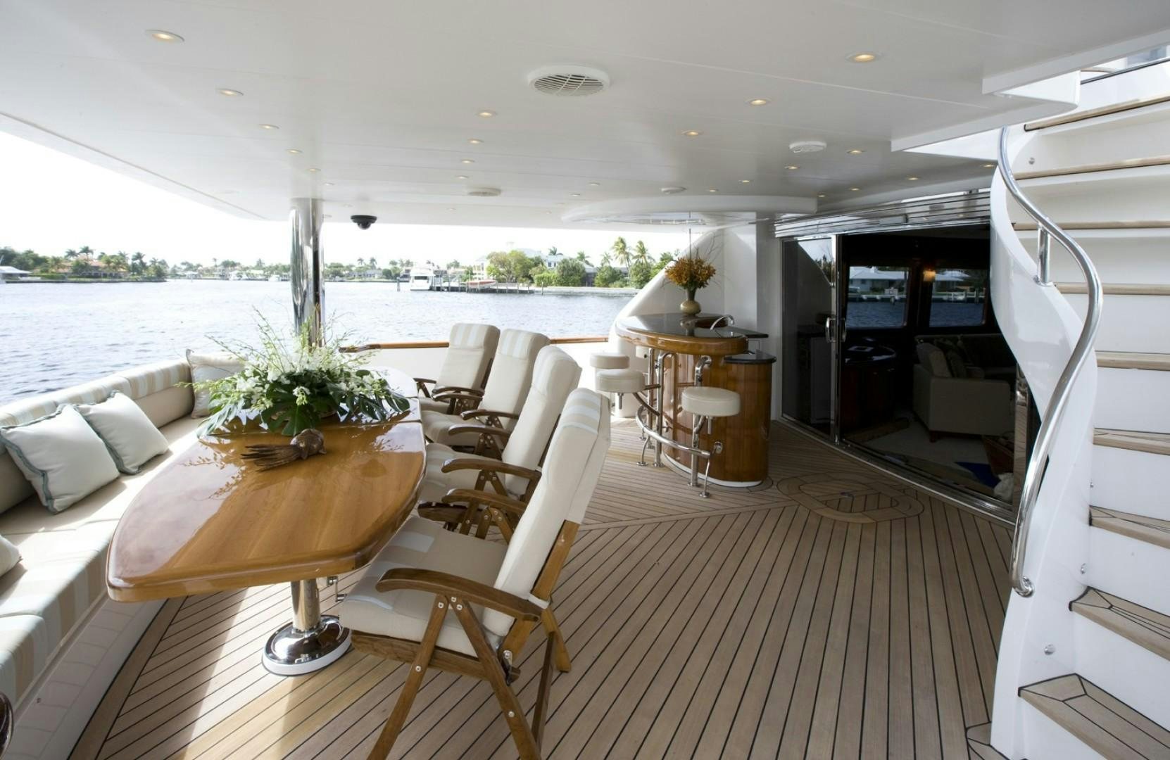 a room with a table chairs and a large window aboard GLEN ELLEN Yacht for Sale
