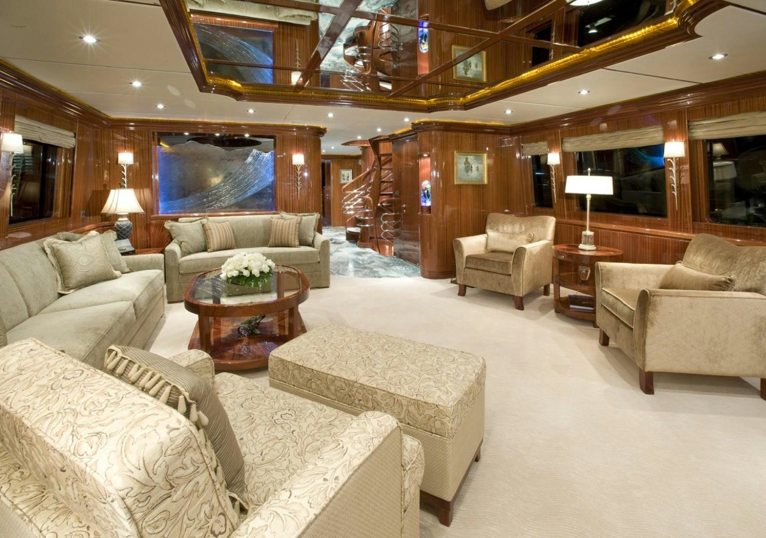 a living room with a staircase aboard GLEN ELLEN Yacht for Sale