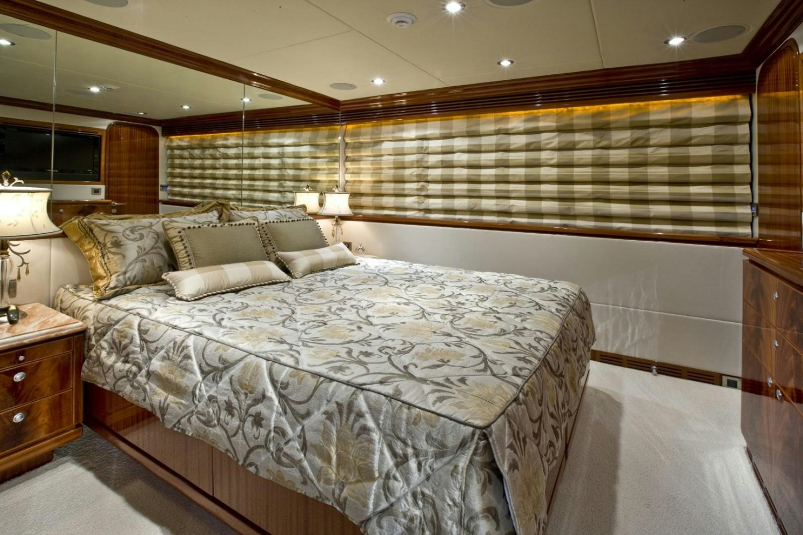 a room with a bed and a lamp aboard GLEN ELLEN Yacht for Sale