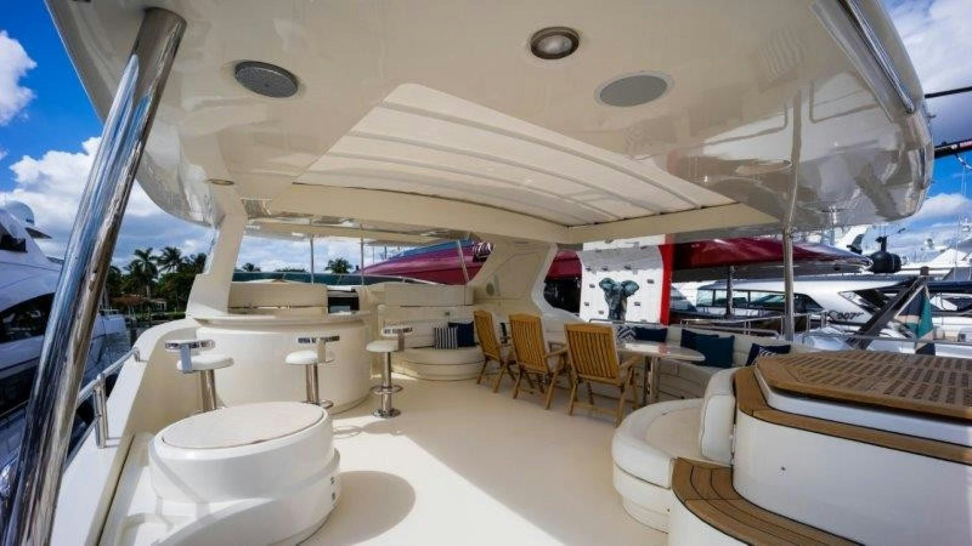 a room with tables and chairs aboard NYHAVEN Yacht for Sale