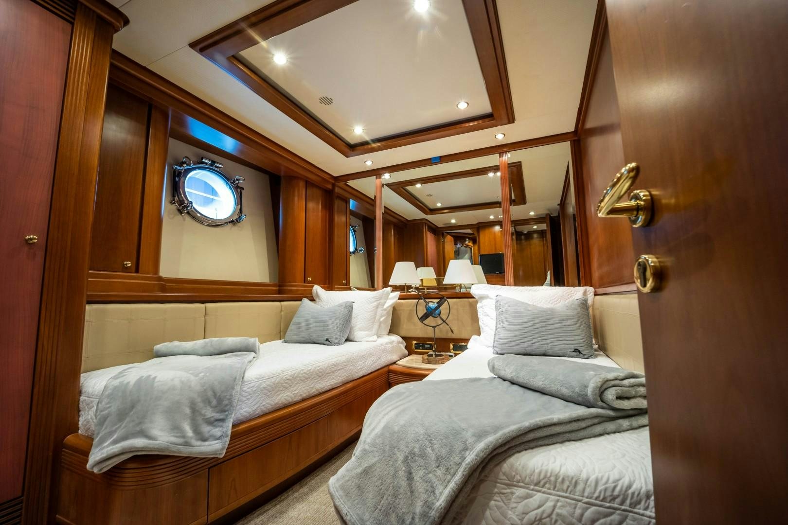 a room with two beds aboard NYHAVEN Yacht for Sale