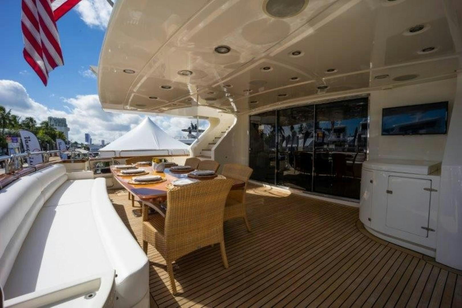 a room with tables and chairs aboard NYHAVEN Yacht for Sale